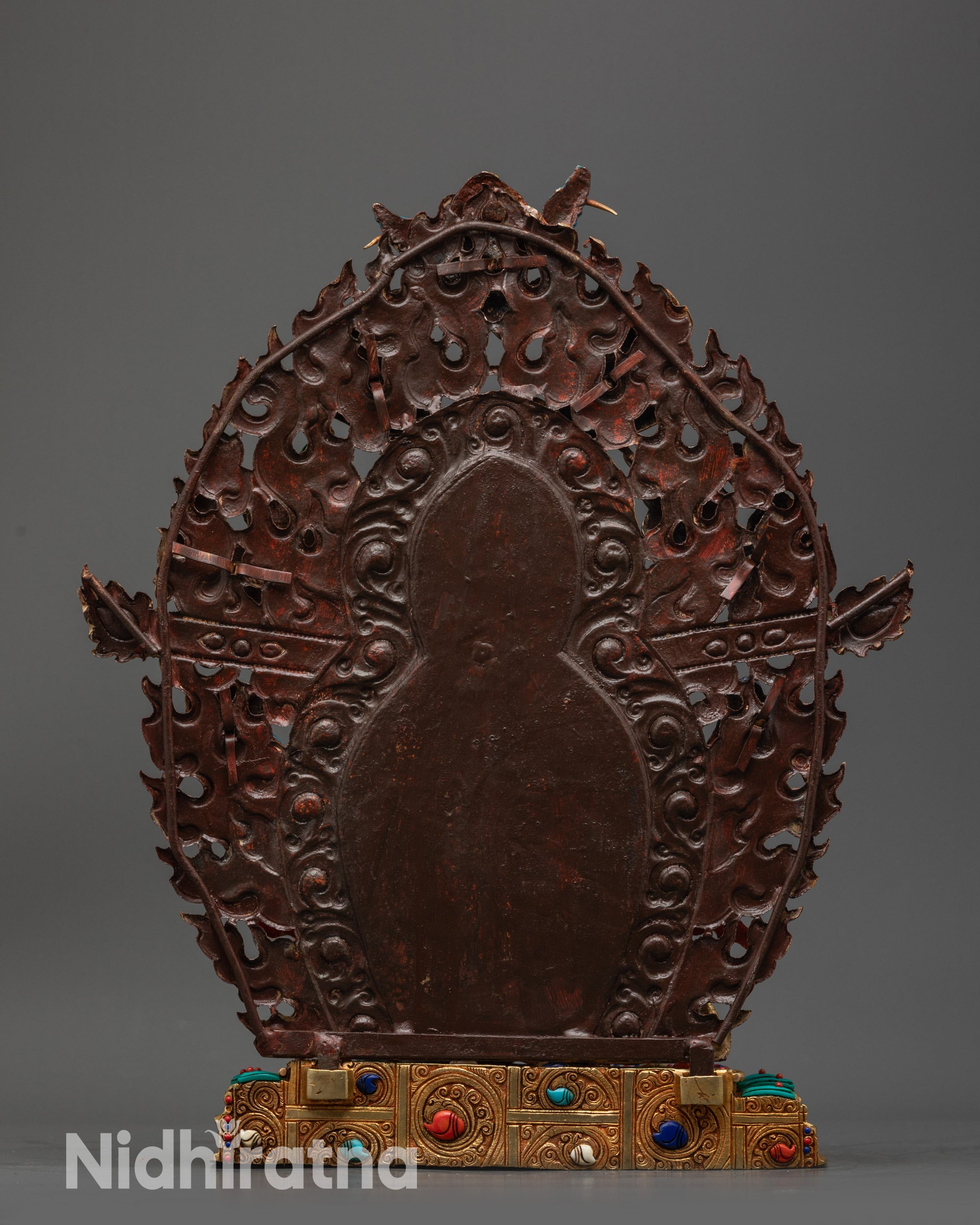 Back view Black Dzambhala featuring wrathful flame halo, deities, and lotus offerings