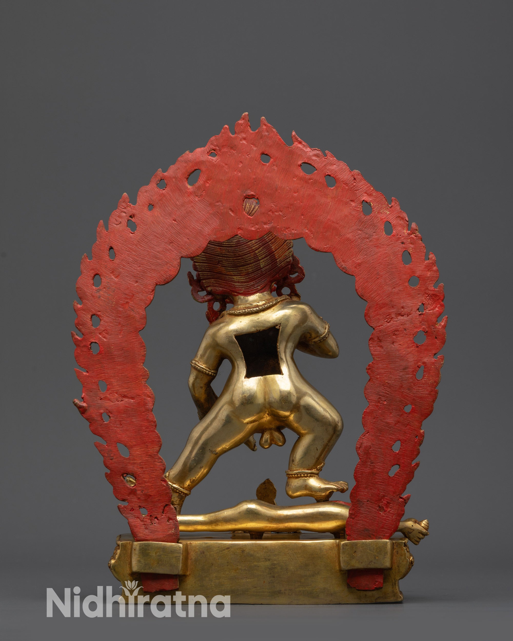 Back view Black Jambhala Nepalese sculpture with flame halo and lotus seat carvings