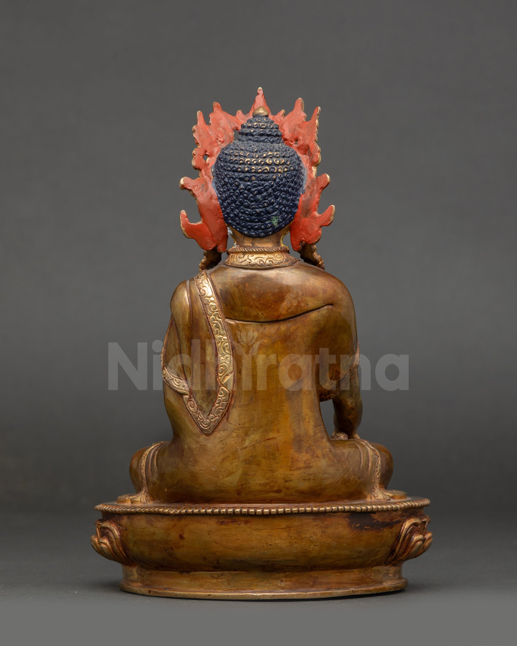 Back view Buddha Shakyamuni Statue showing robe draping and lotus moon disc base