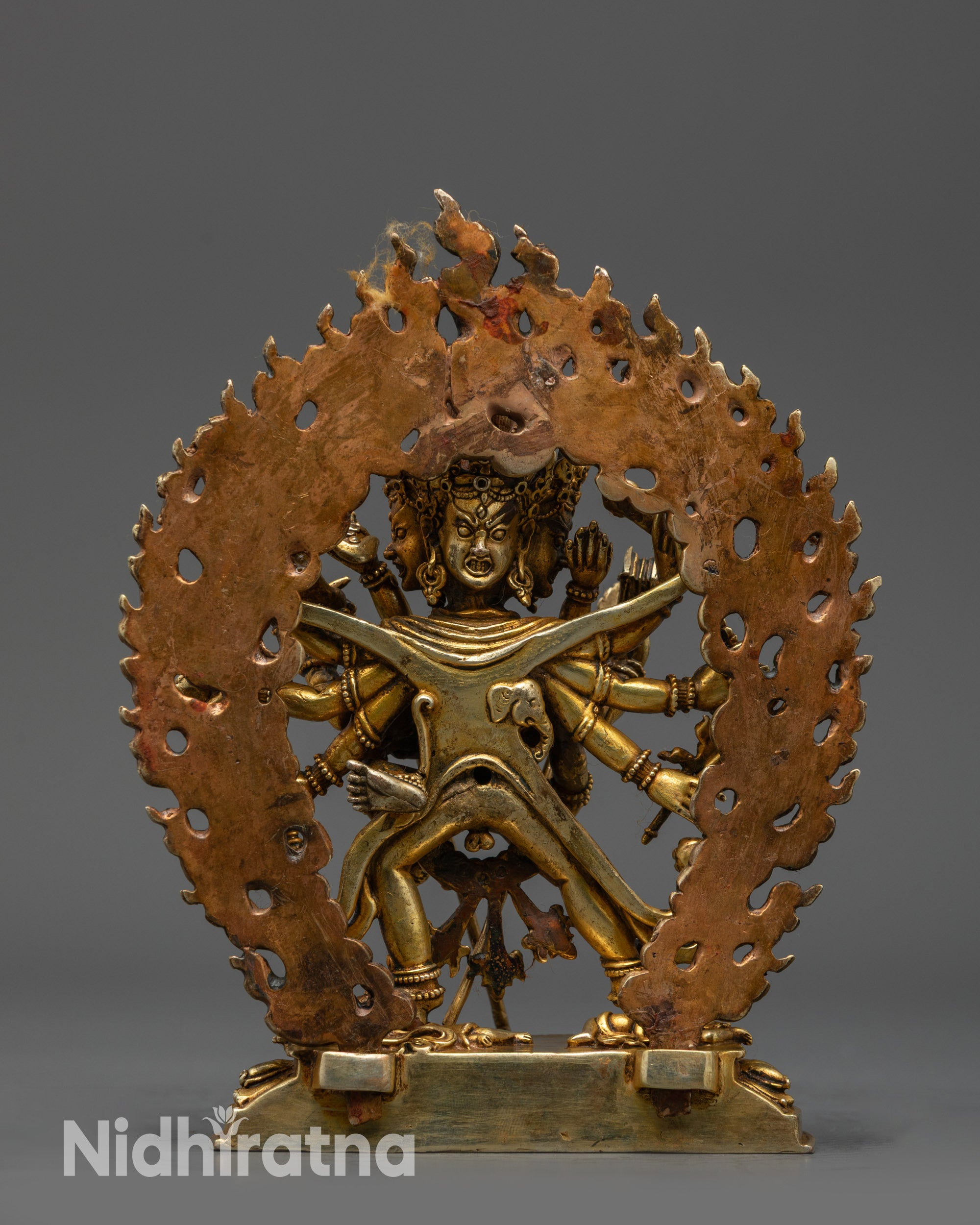 Back view Chakrasamvara Statue showing crown, three heads, and lotus base details