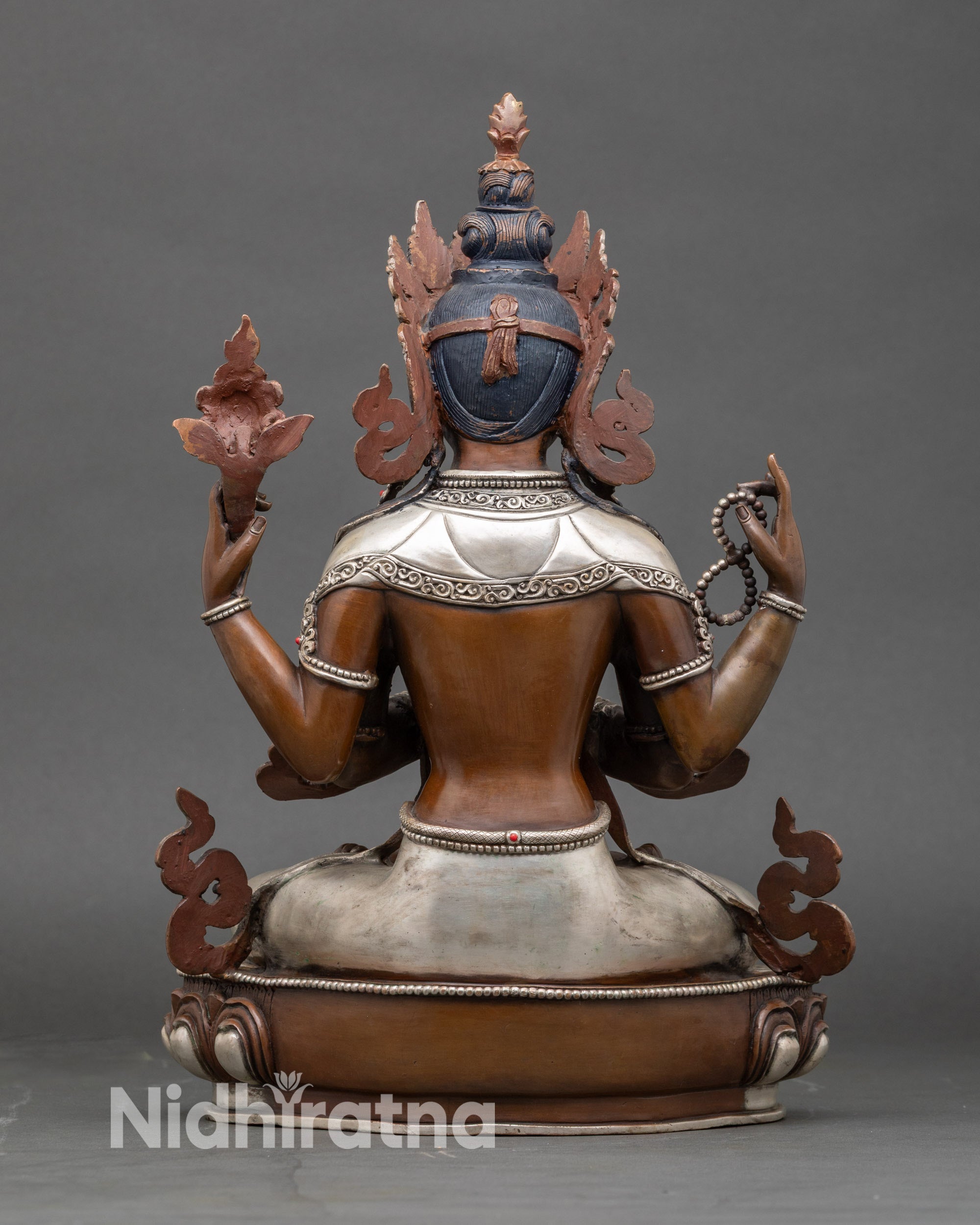 Back view Chenrezig statue – detailed lotus pedestal and intricately carved robes