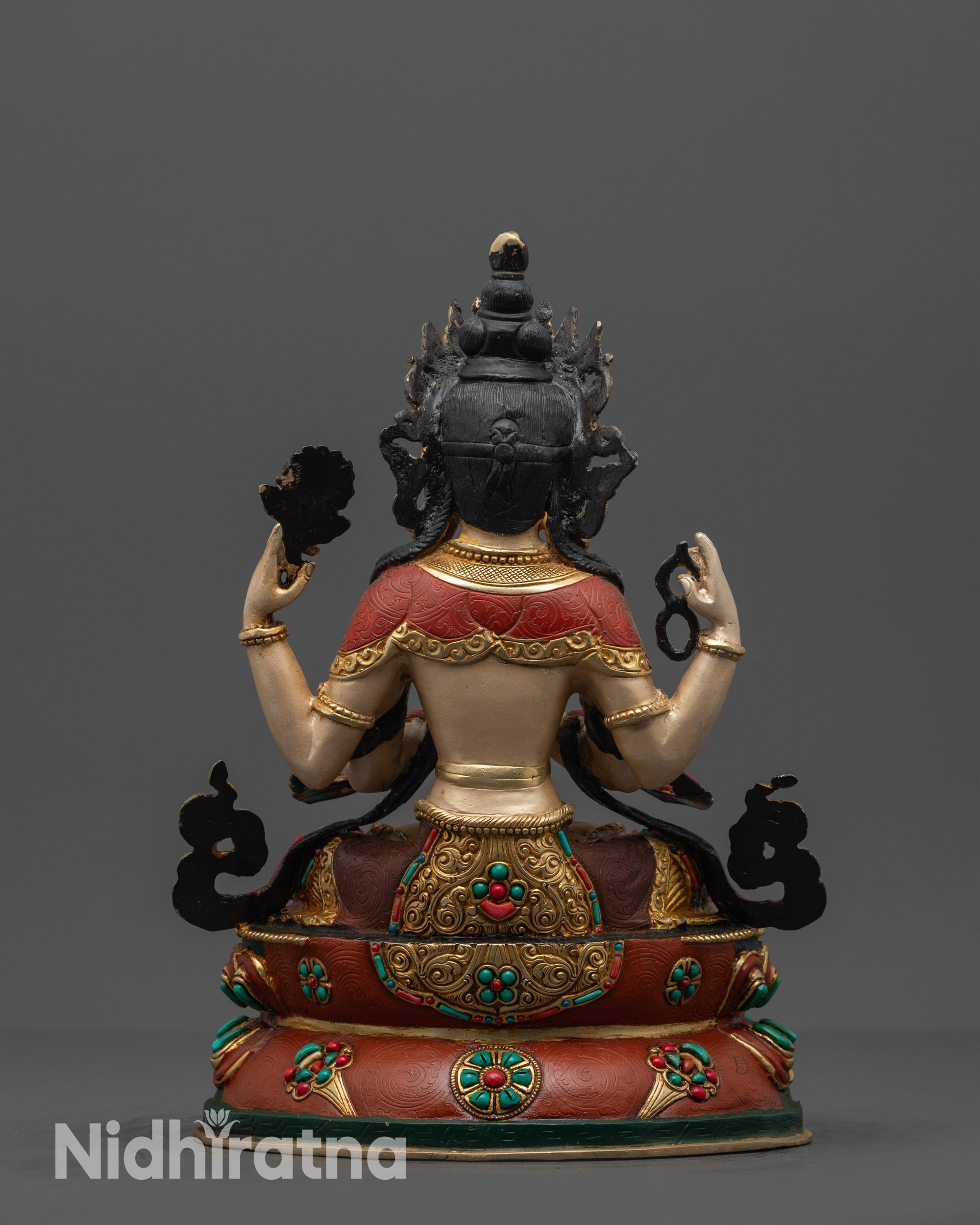 Back view Chenrezig statue on colored and gold-plated lotus with detailed carvings