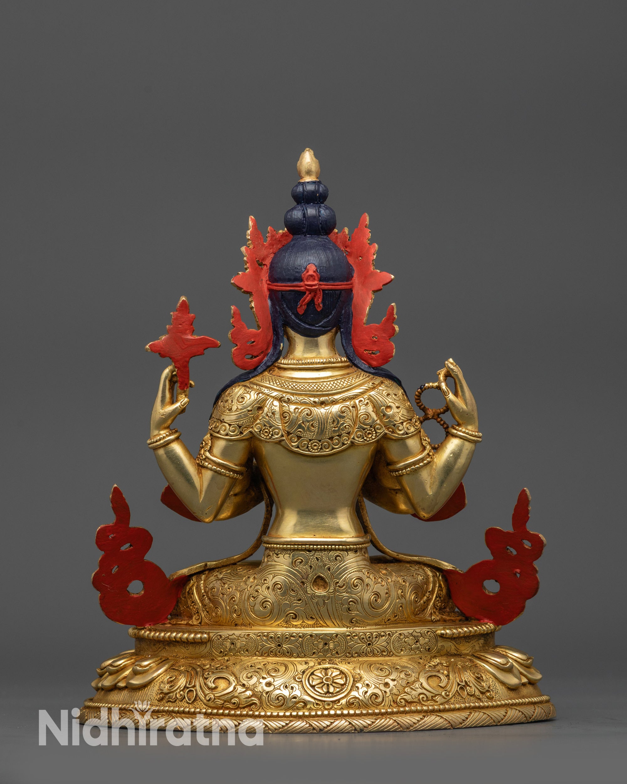 Back view Chenrezig statue with carved floral motifs on lotus seat