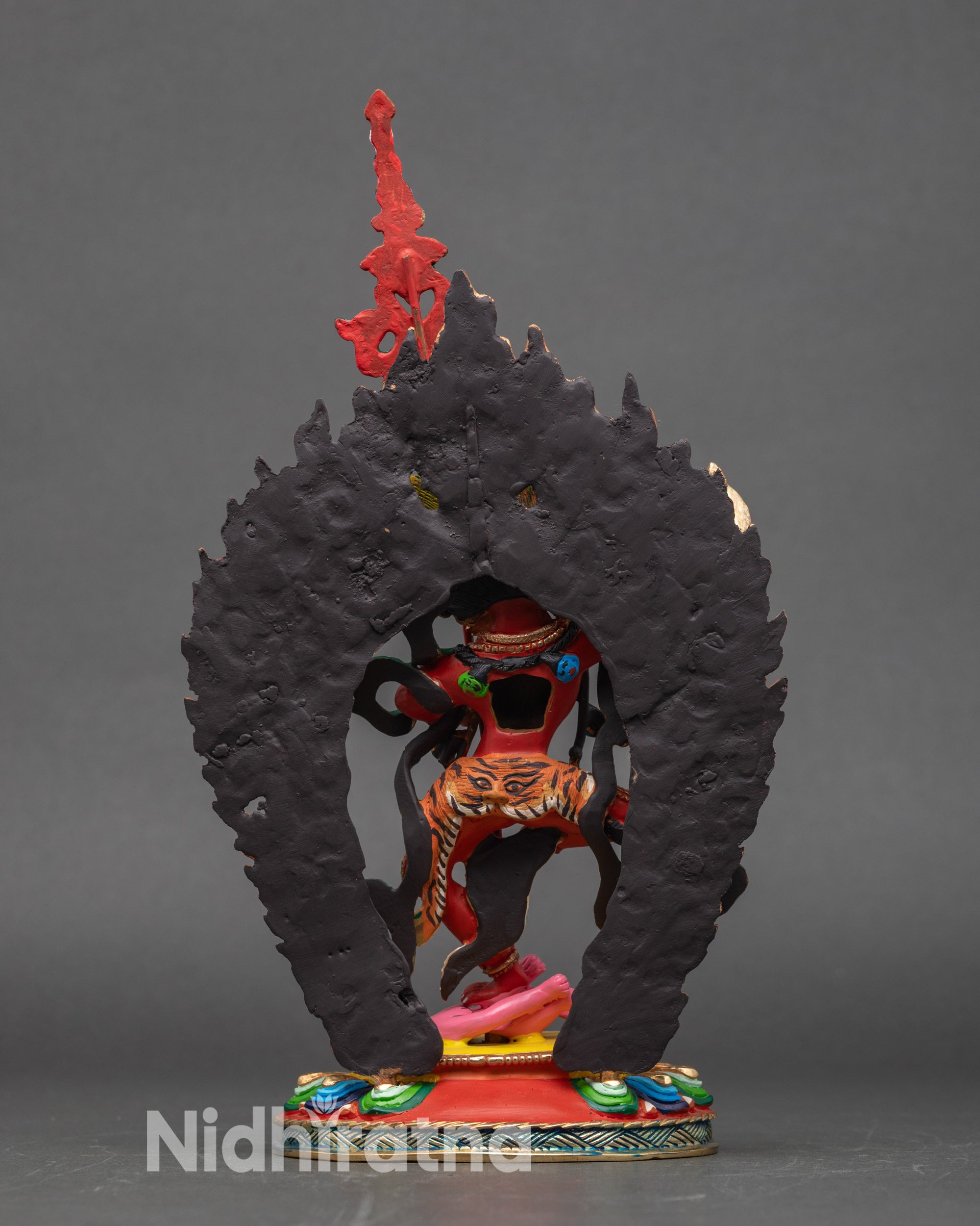 Back view Dorje Phagmo statue blazing halo stepping on evil spirit Nepalese art