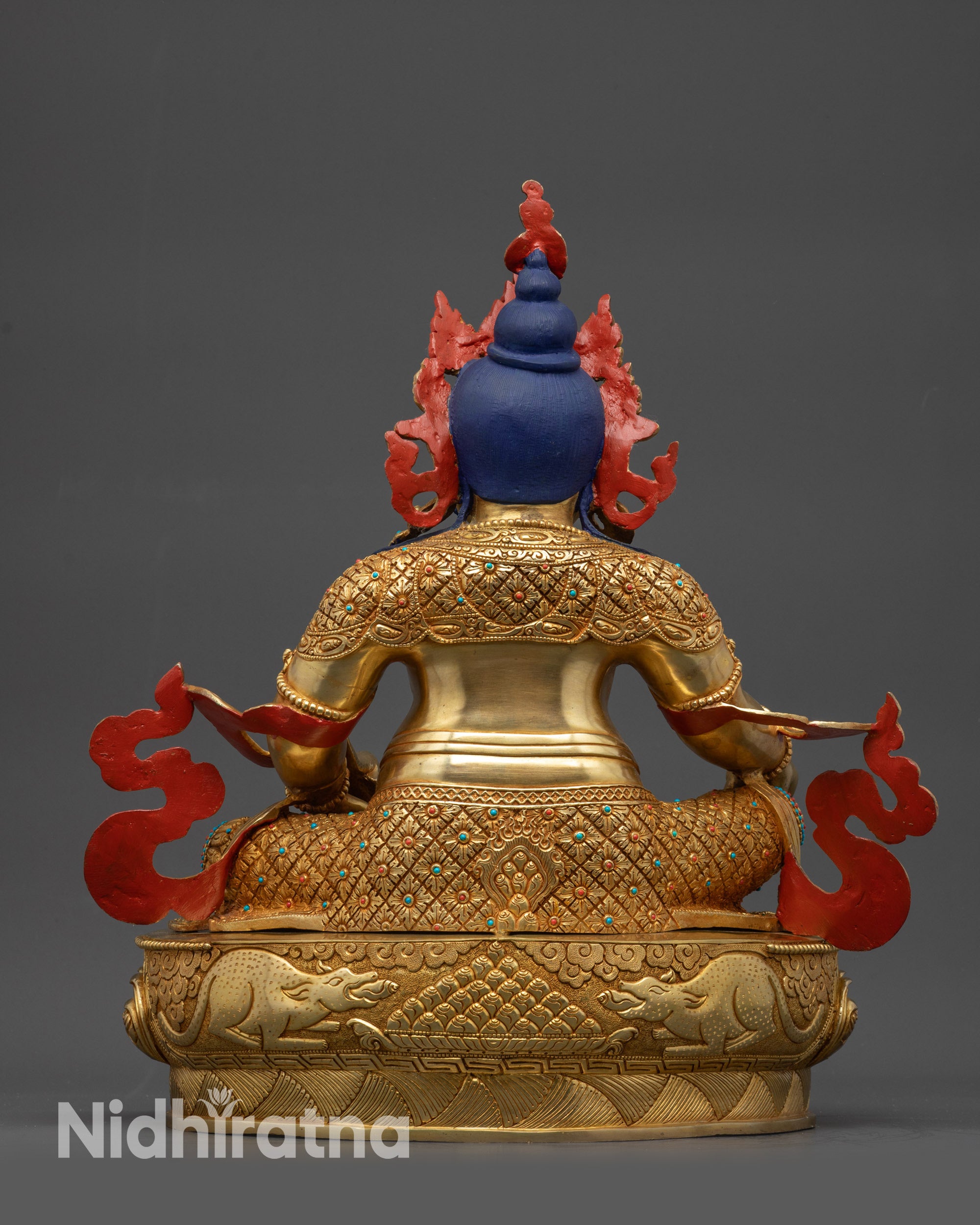 Back view Dzambhala Statue showing carved patterns and gold fire-gilded base