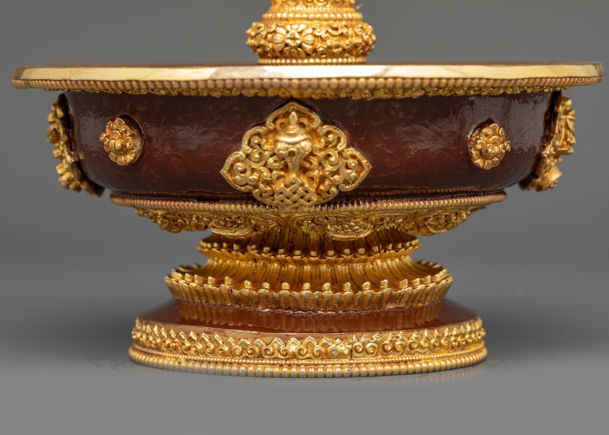 Back view Golden Serkyem Offering Tibetan altar vessel protecting spiritual energy