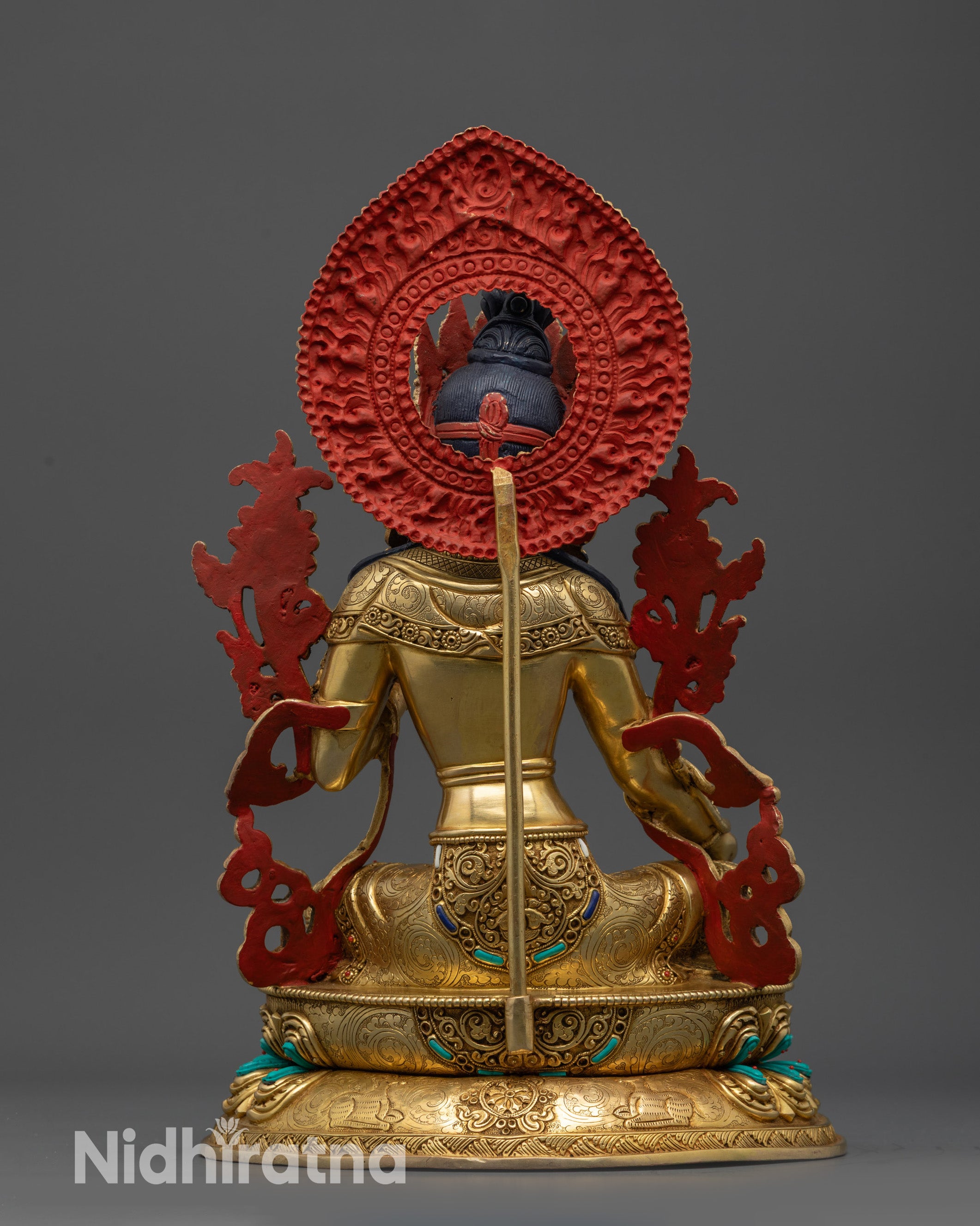 Back view Green Tara Sculpture highlighting floral halo motifs and artisan metalwork