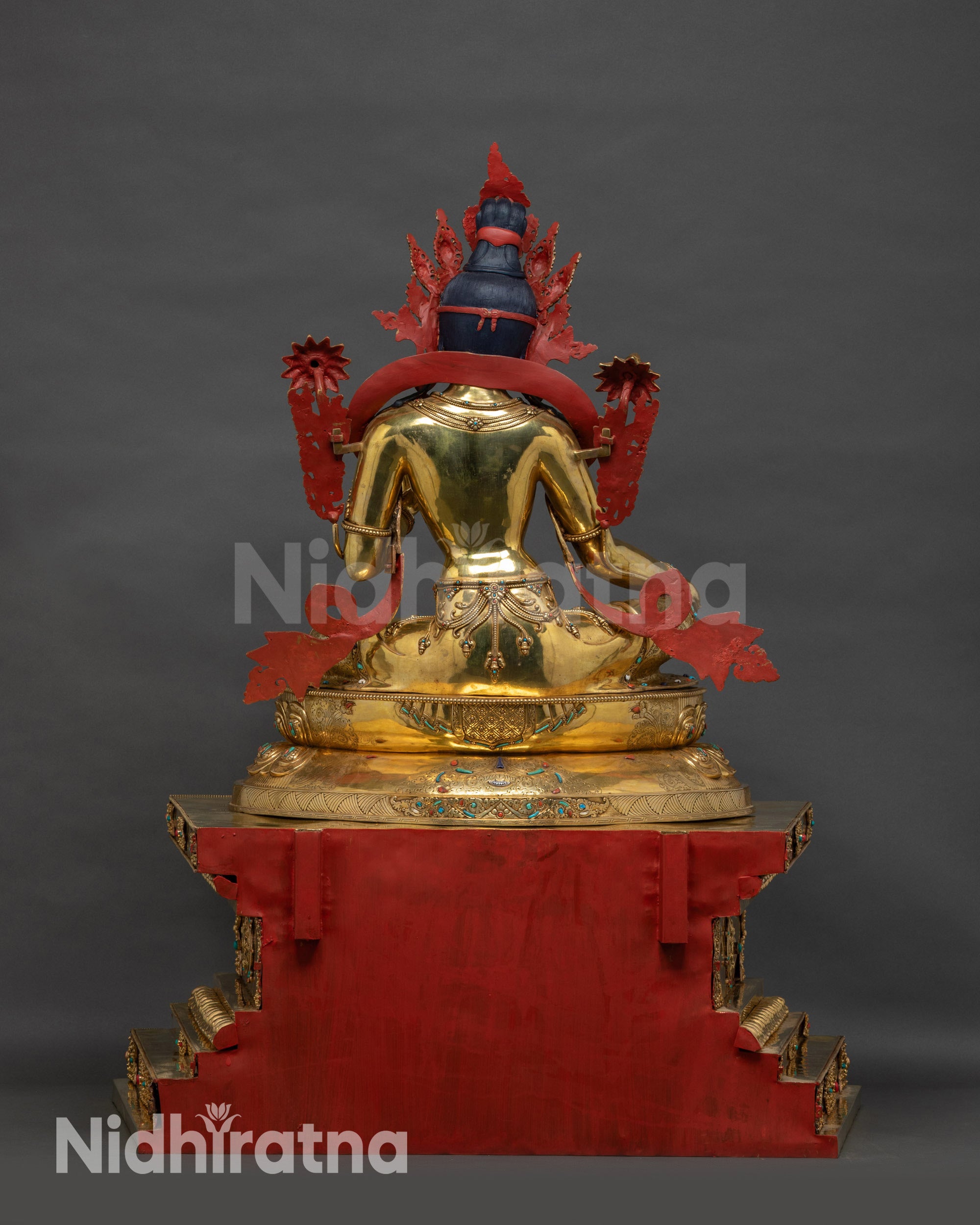 Back view Green Tara Statue with multicolored stone inlays and intricate carvings