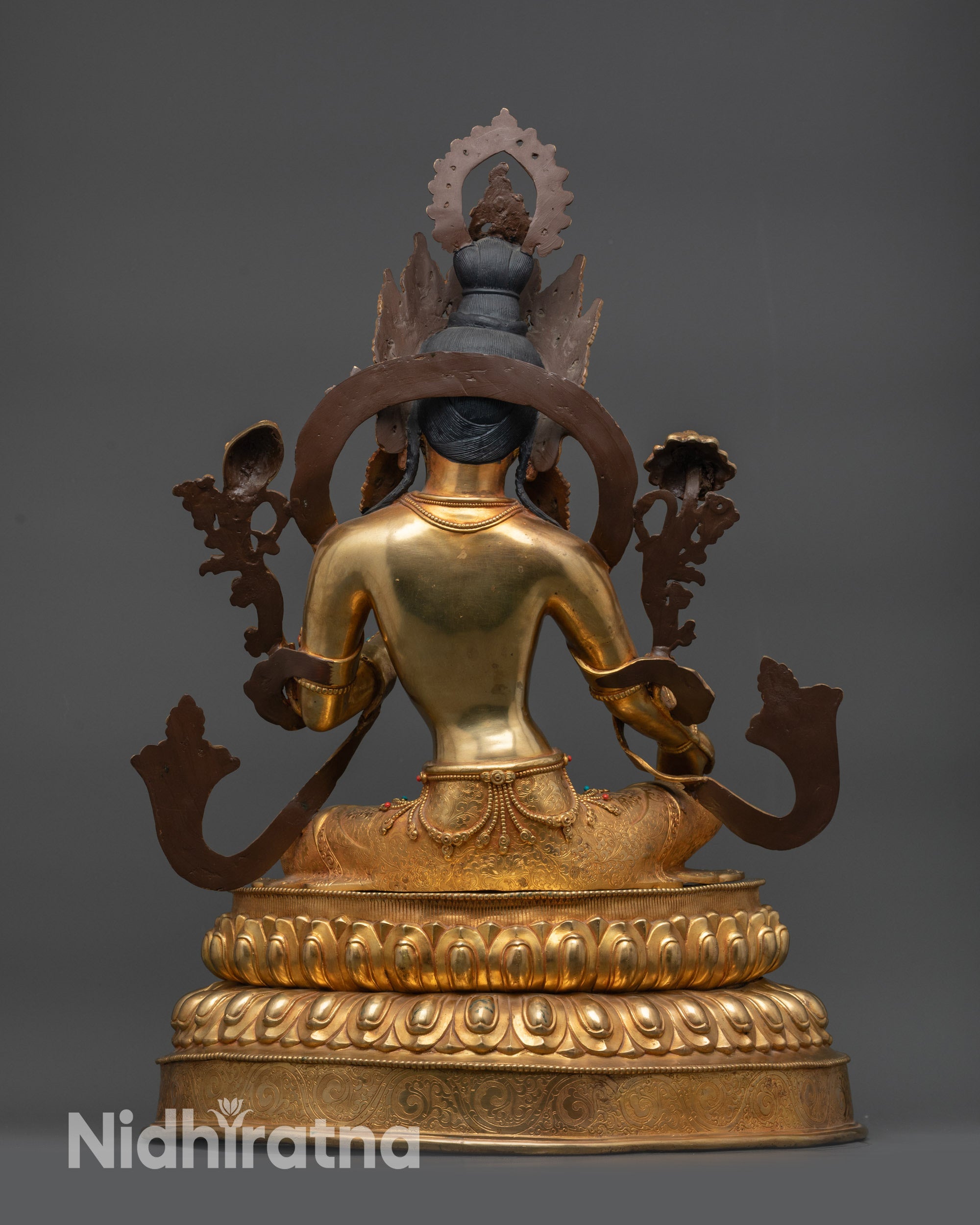 Back view Green Tara statue carved robe and lotus pedestal with intricate petal designs