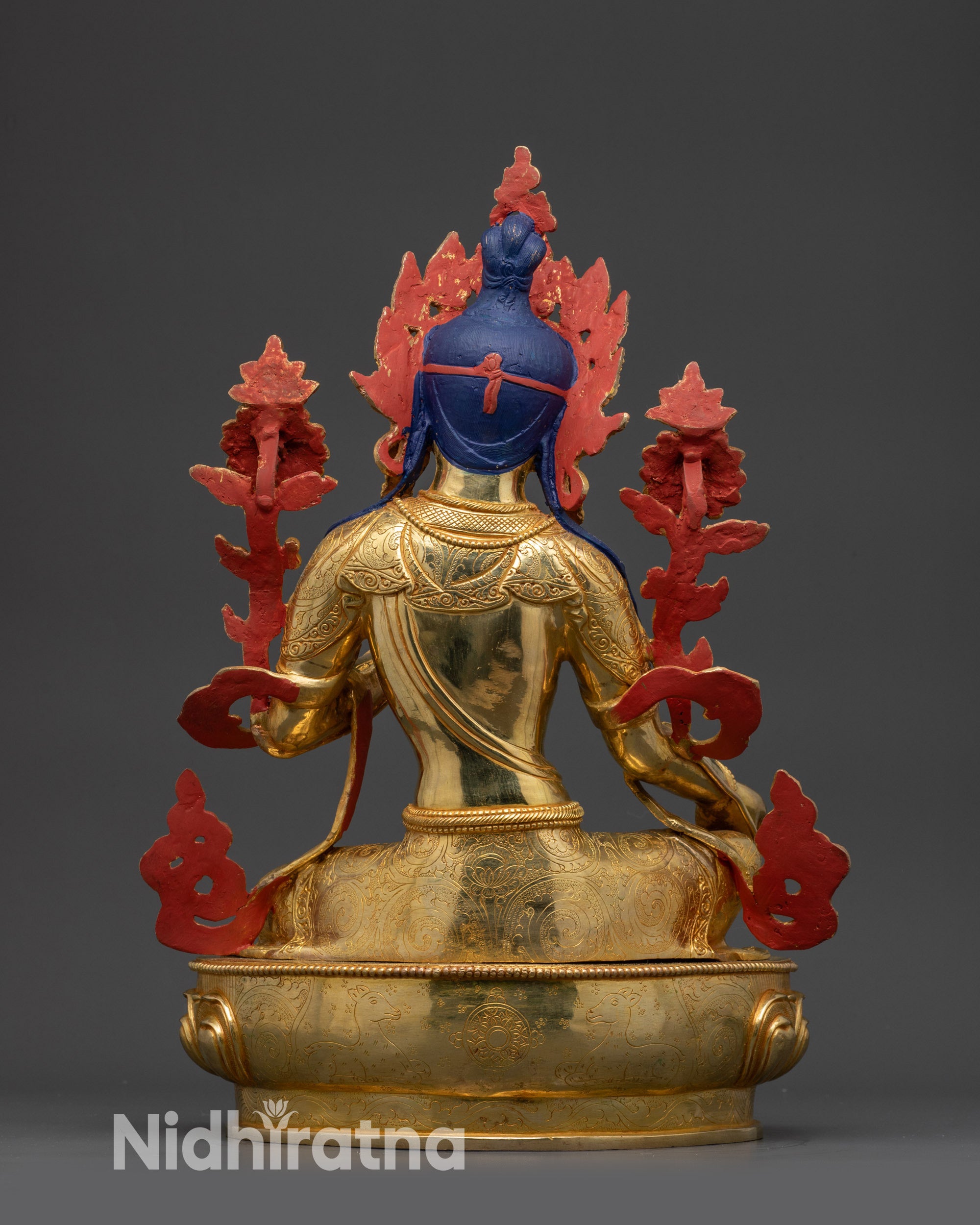 Back view Green Tara statue highlighting carved robe and intricate lotus seat patterns