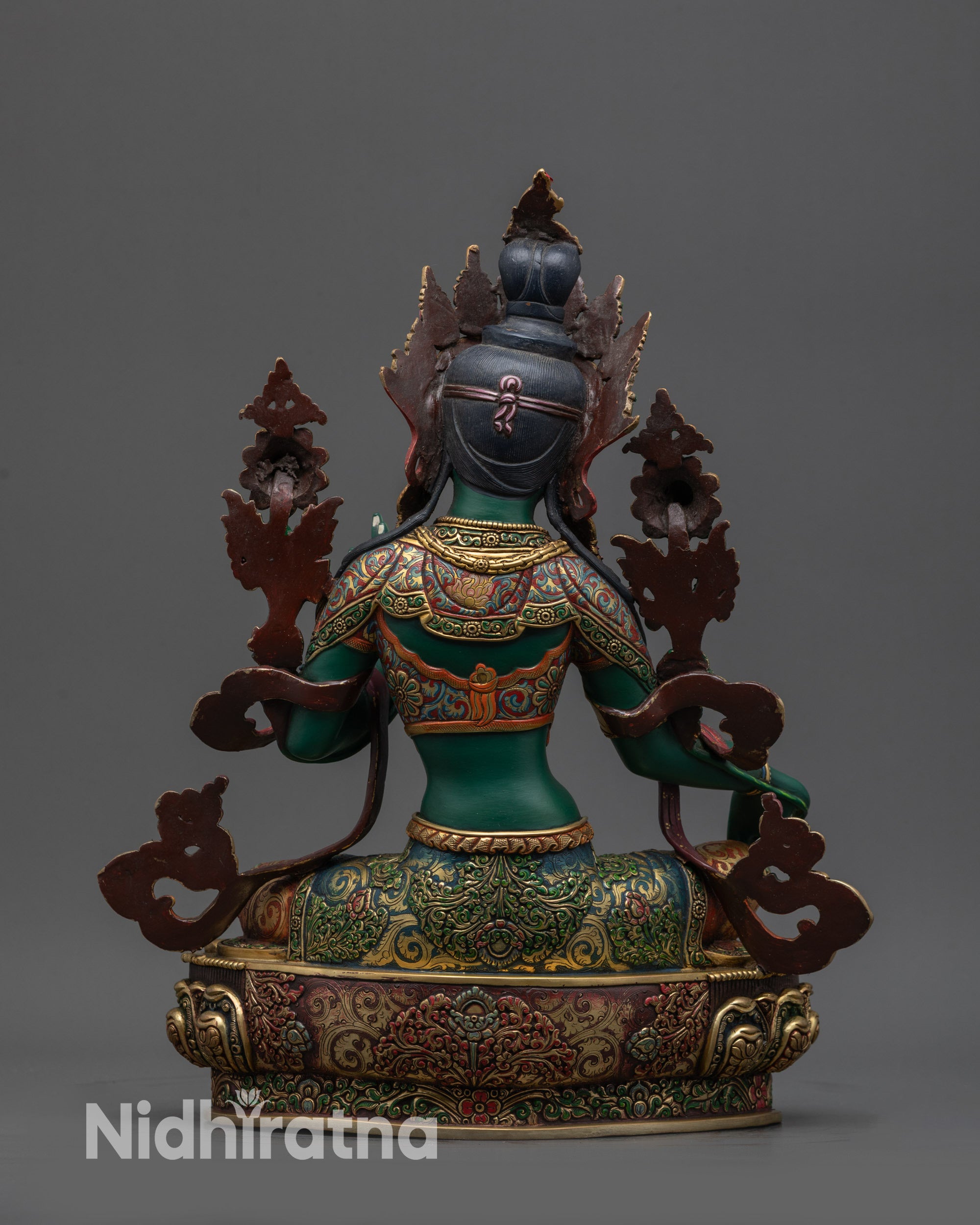 Back view Green Tara statue with carved floating robe and gold-gilded lotus base details