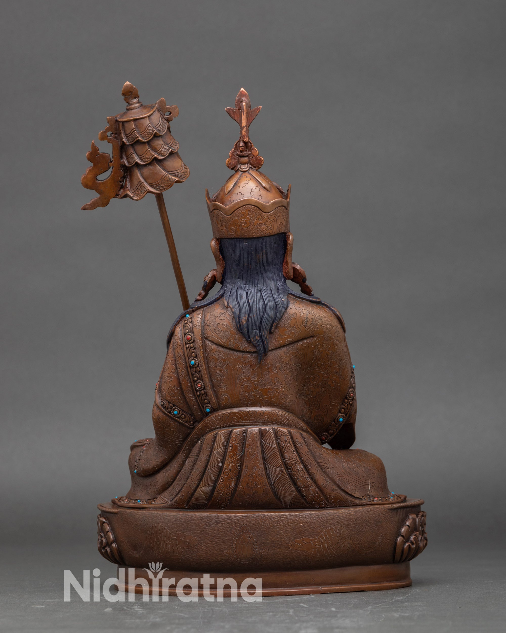 Back view Guru Norlha sculpture, handcrafted Nepalese Buddhist statue with oxidized finish