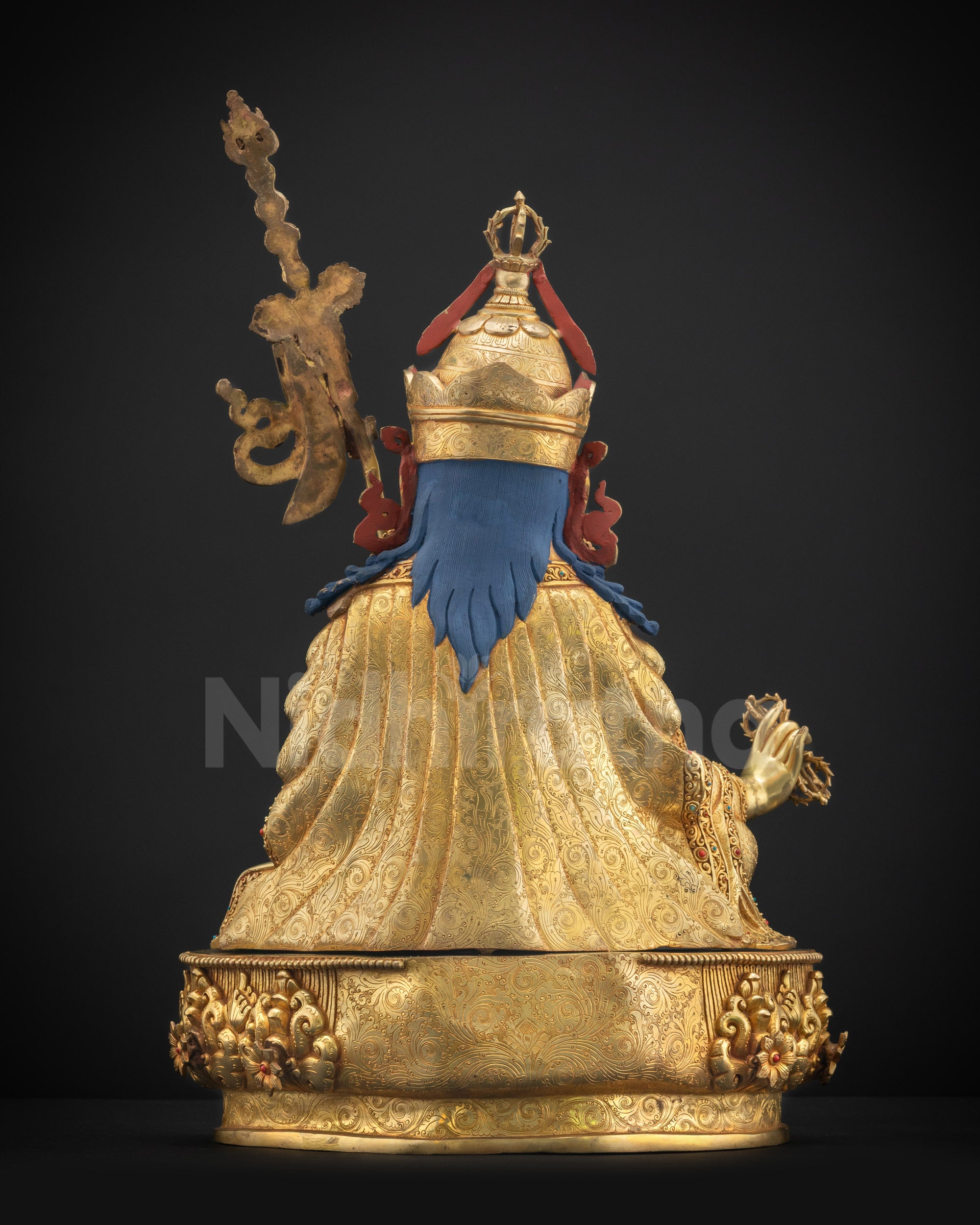 Back view Guru Rinpoche statue showing carved lotus pedestal and attire details
