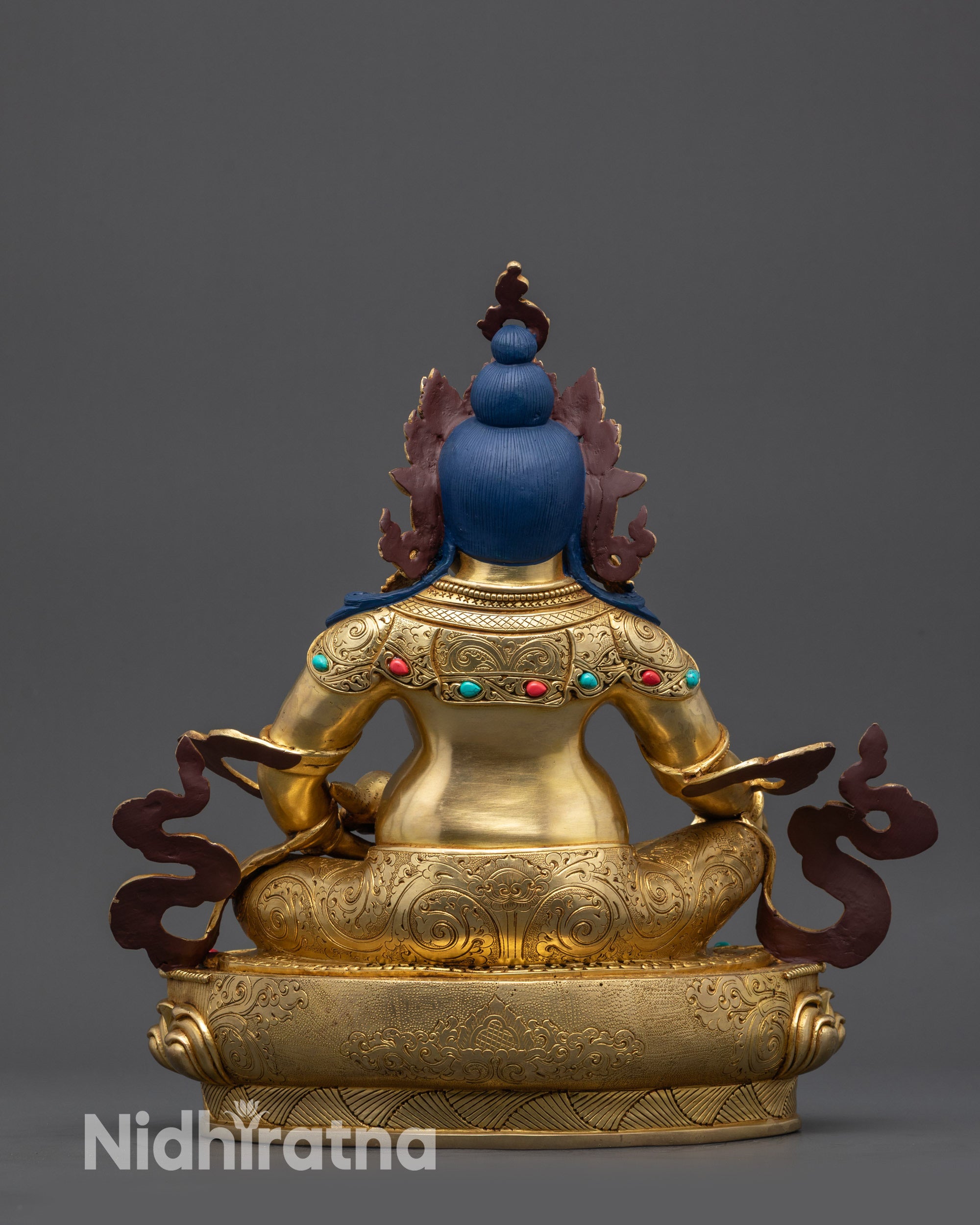 Back view Handmade Jambhala Sculpture showing robe patterns and detailed carvings