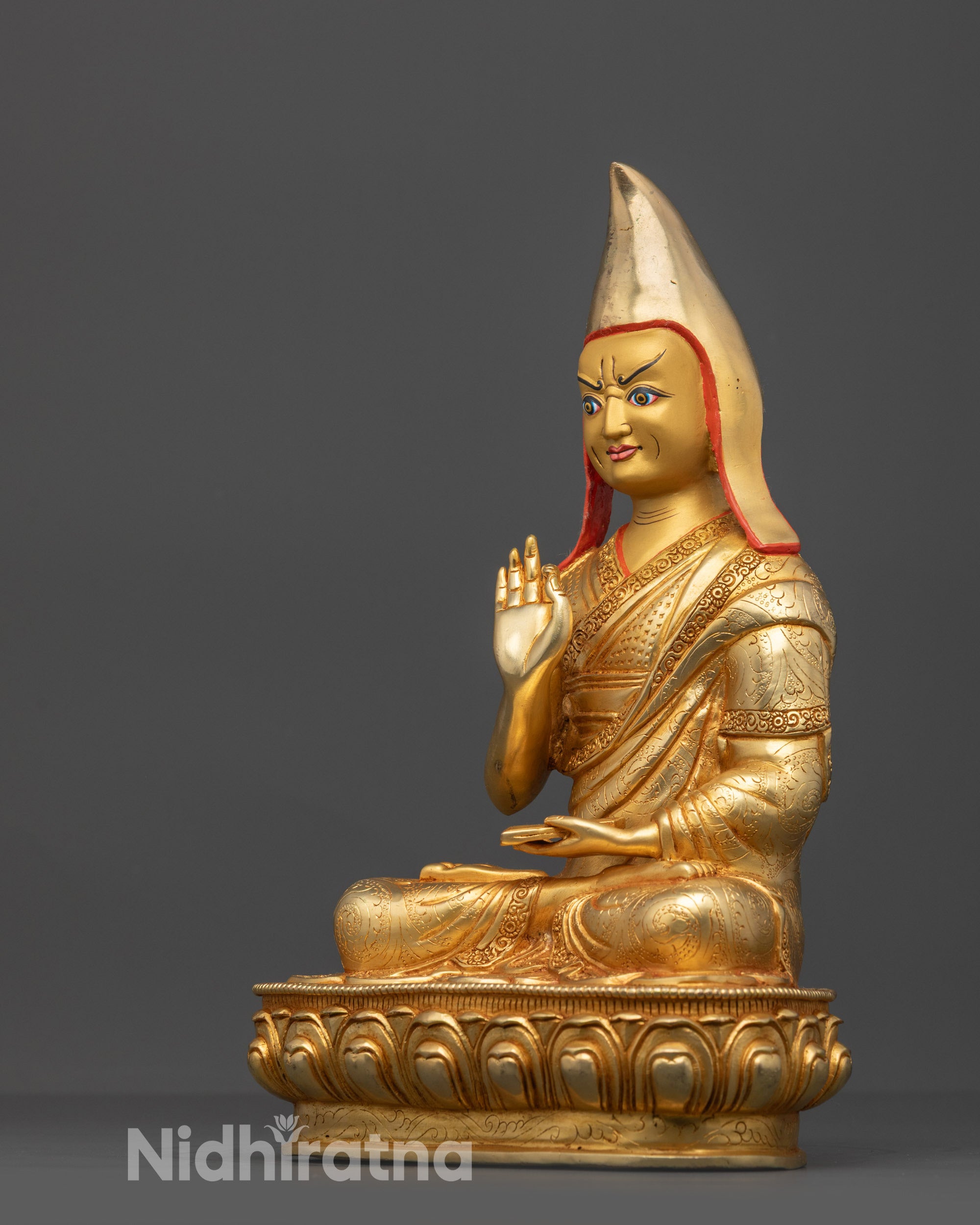 Back view Khedrup Je disciple statue showing carved robe and lotus throne details