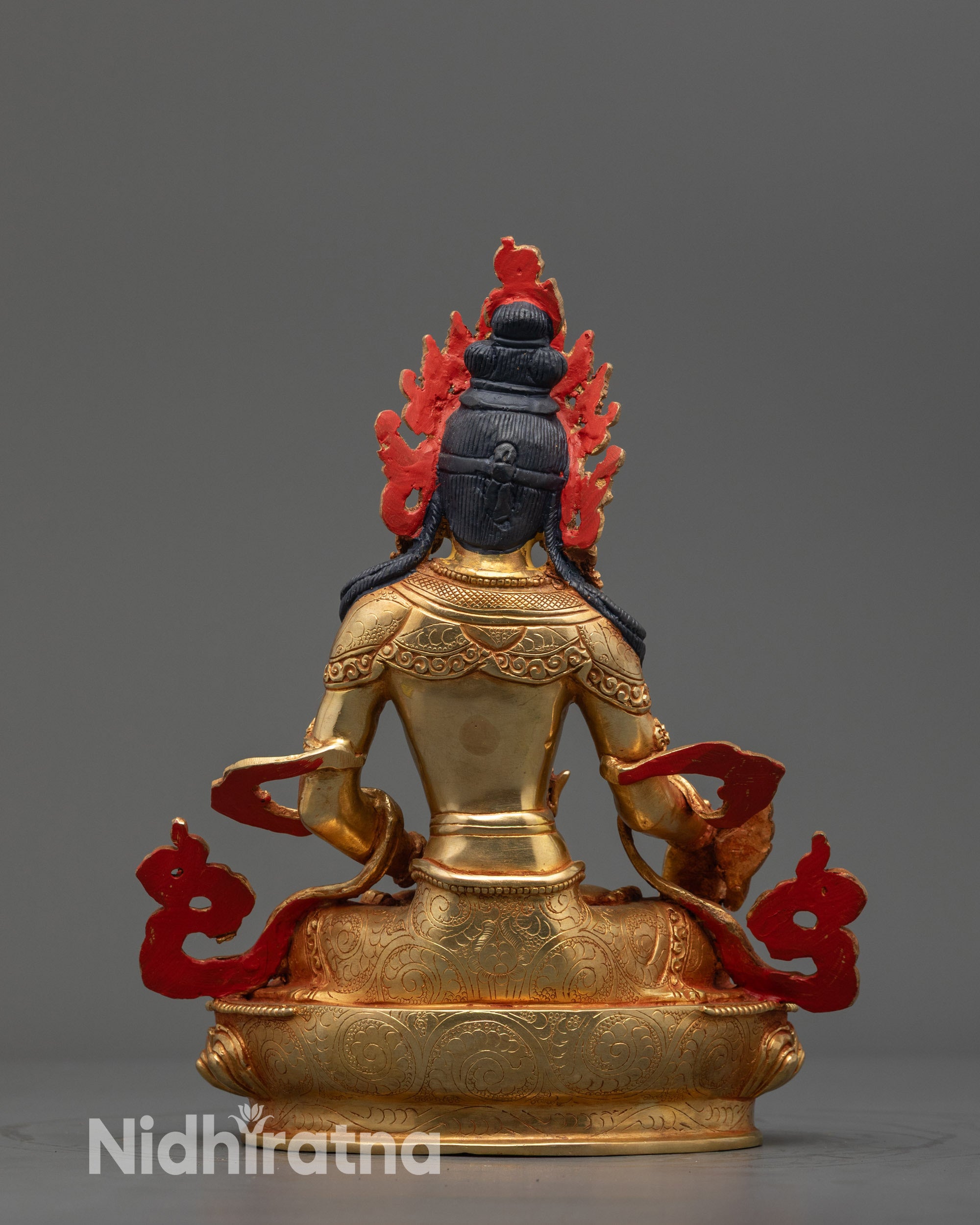 Back view Ksitigarbha Statue highlighting intricately carved garments and calm expression