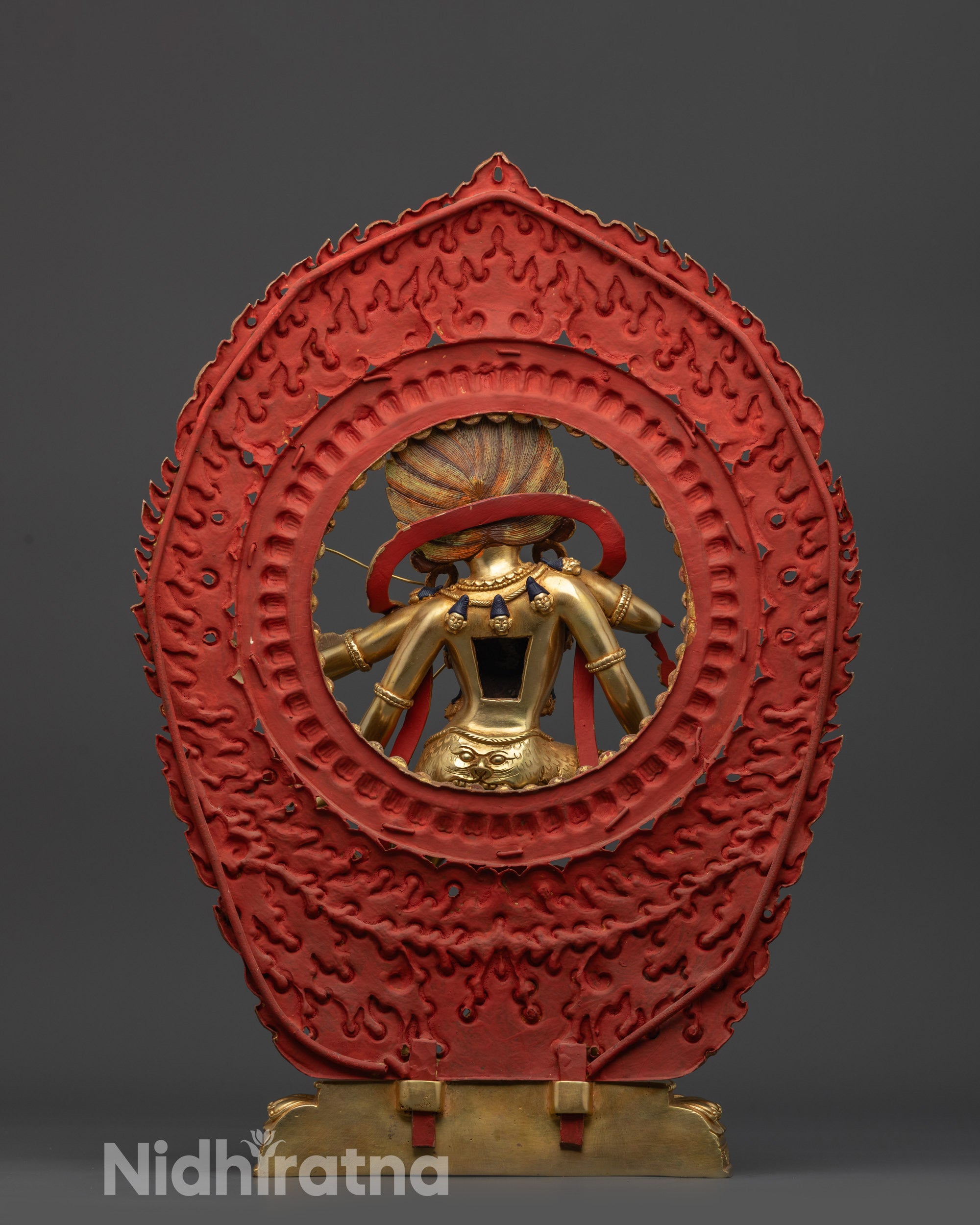 Back view Kurukulla statue highlighting gold fire-gilded body and blazing halo from rear angle