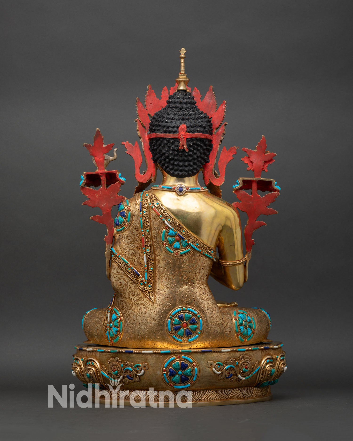 Back view of Maitreya Buddha Statue, revealing detailed copper structure.