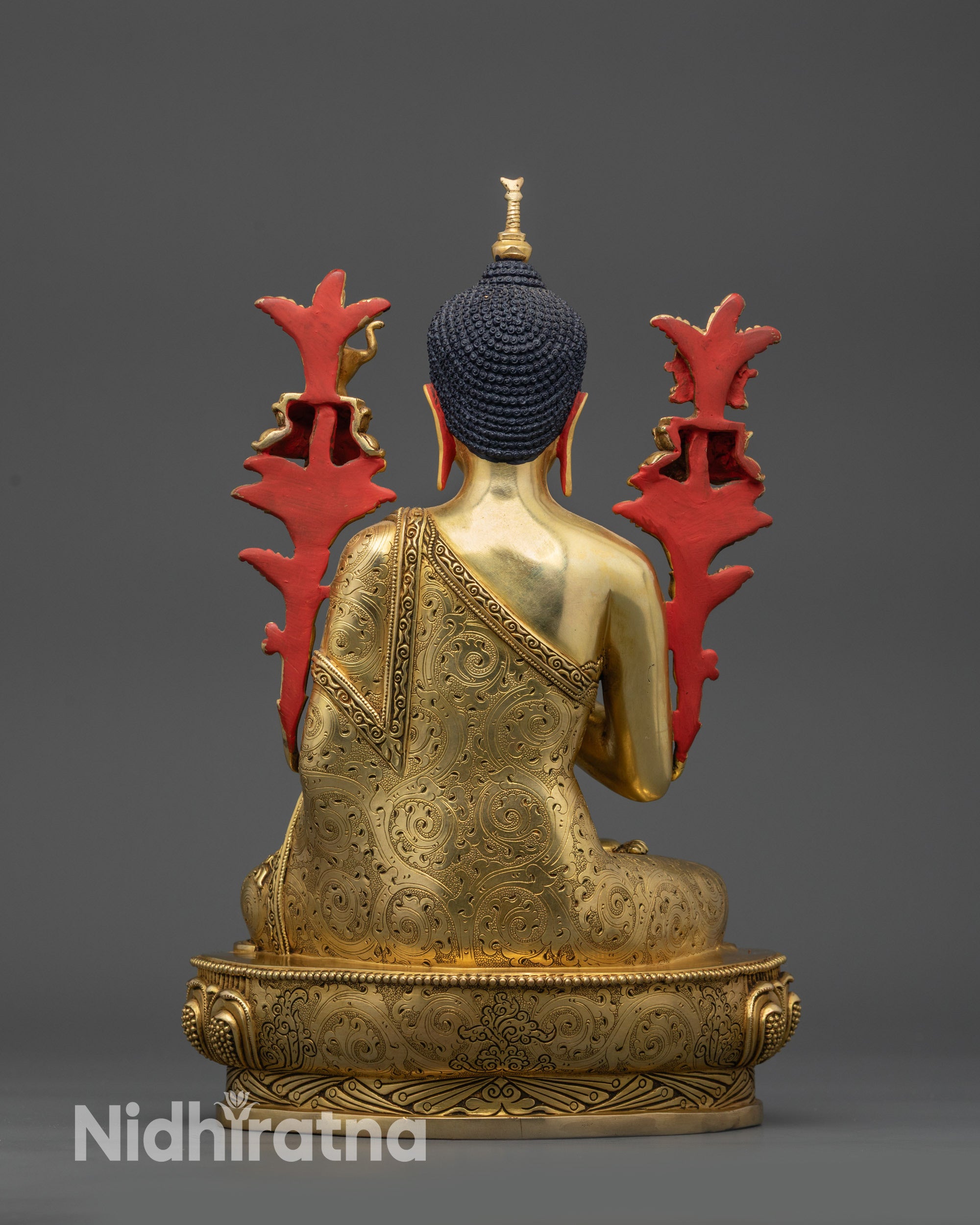 Back view Maitreya Buddha crowned with symbolic stupa and lotus pedestal
