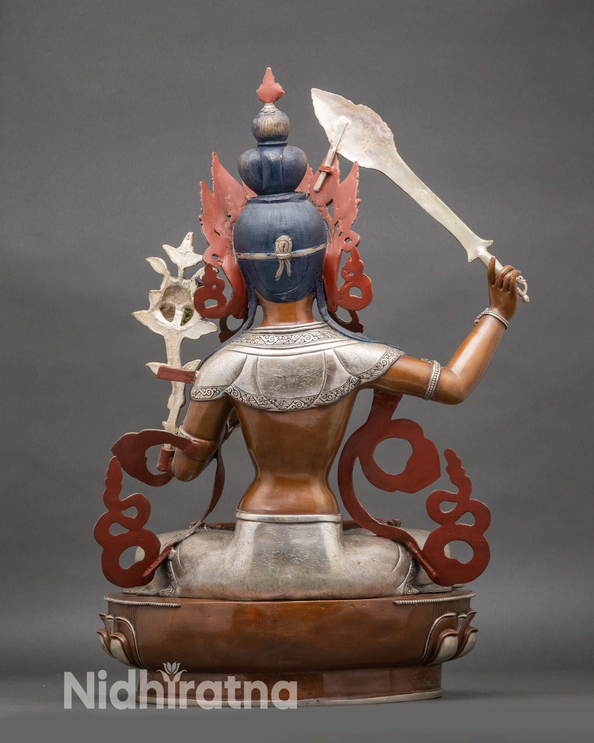 Back view Manjushree statue highlighting Newari craftsmanship and intricate double lotus throne