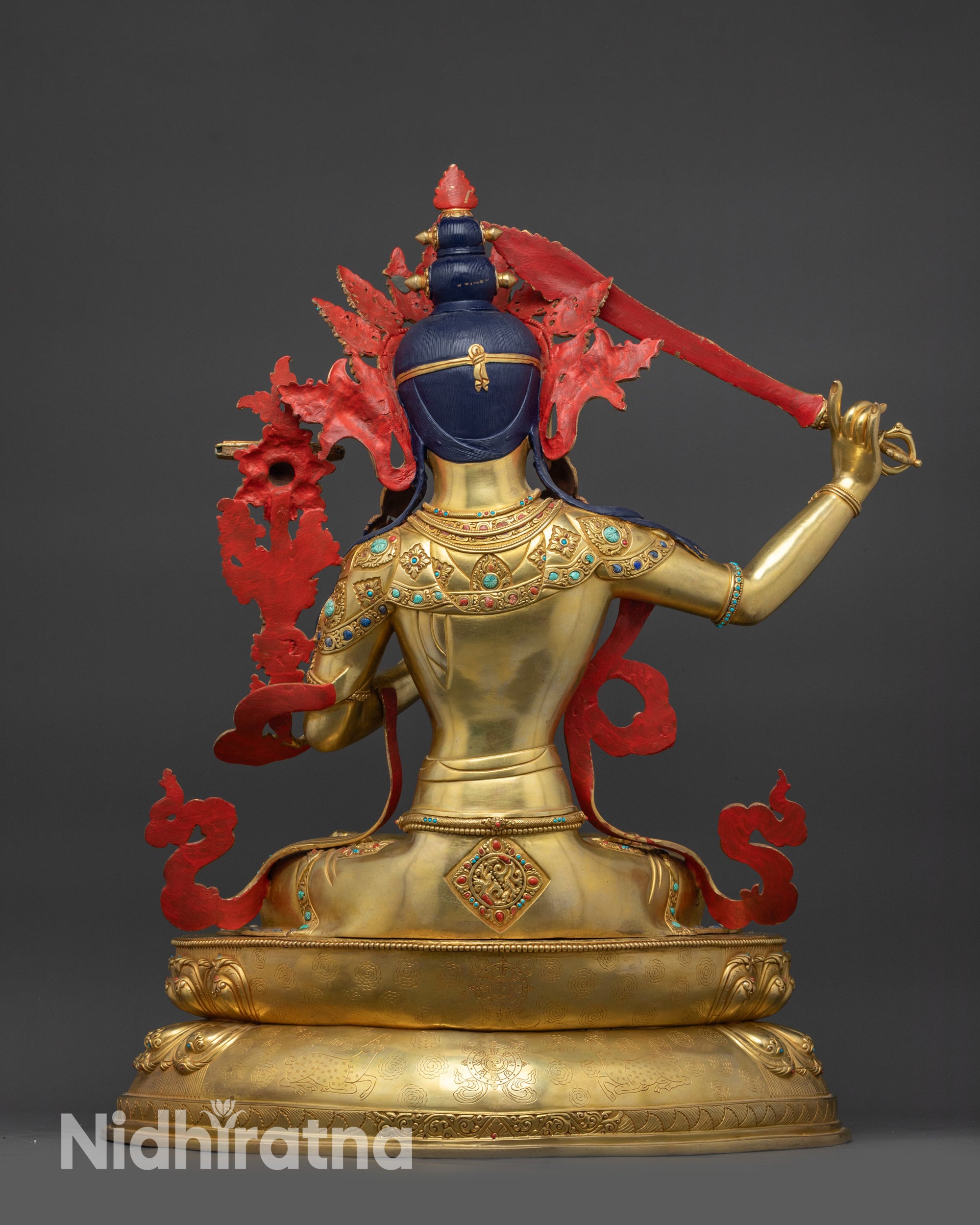 Back view Manjushri Sculpture showing intricate robes and lotus seat details