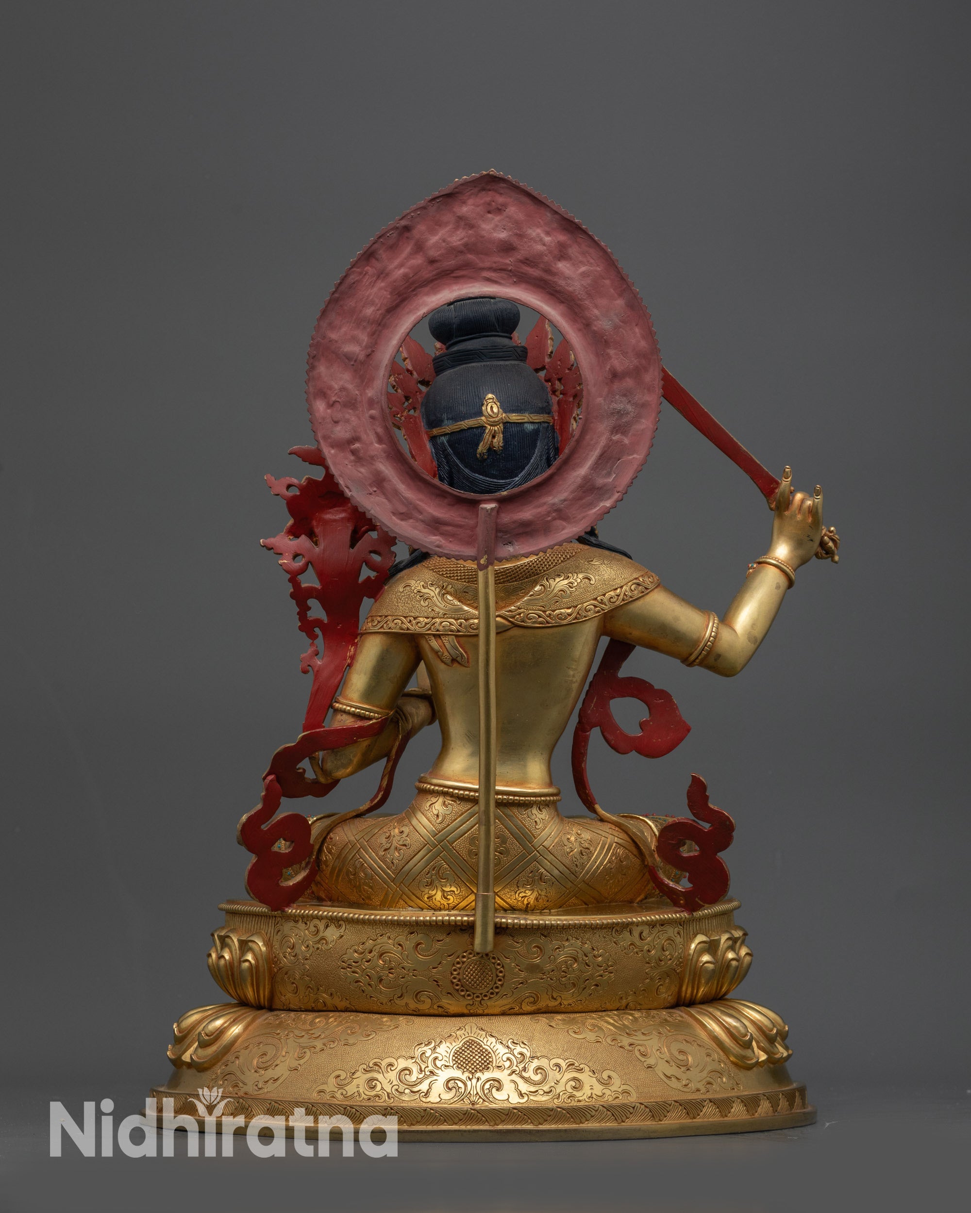 Back view Manjushri Statue highlighting detailed halo, robe carvings and lotus base