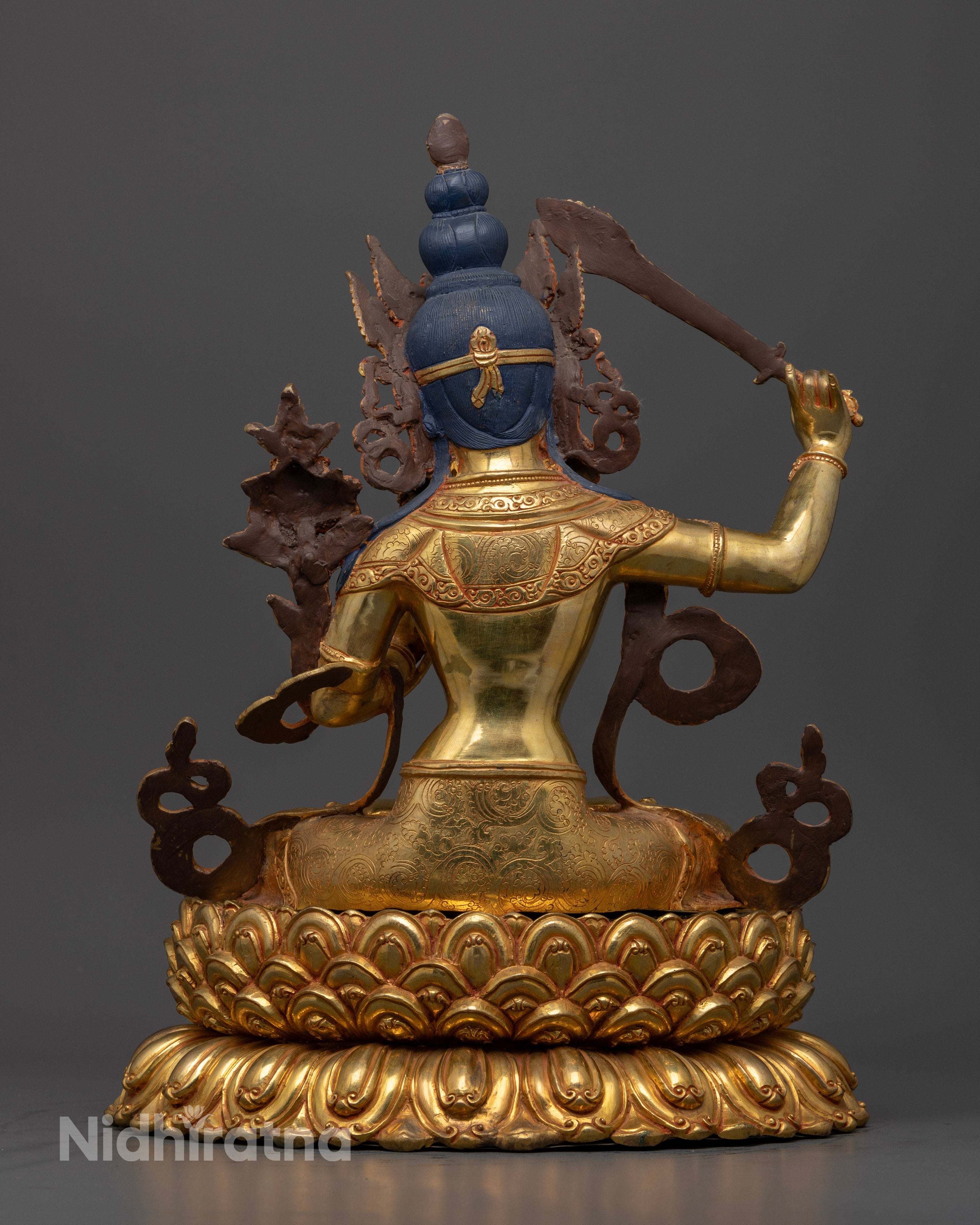 Back view Manjushri statue with intricately carved garments and lotus pedestal, traditional Newari handcrafted sculpture