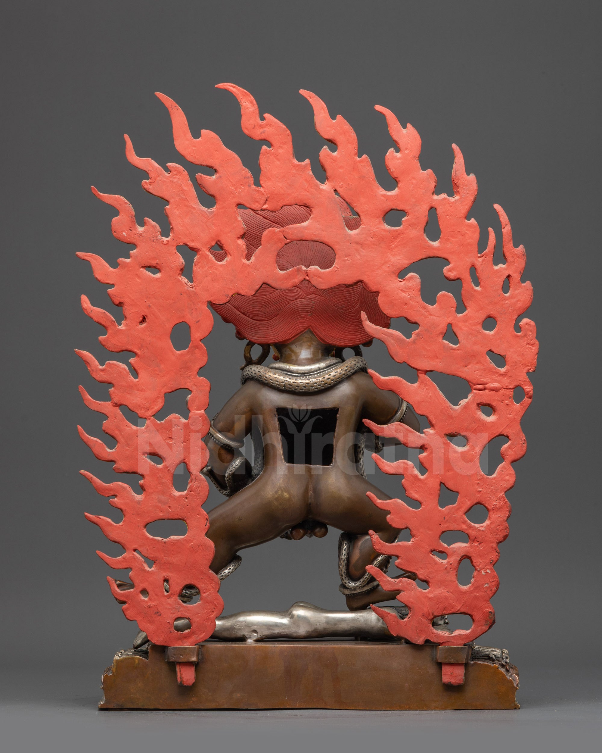 Back view Oxidized Black Dzambhala statue showing detailed wrathful flame halo and back robes