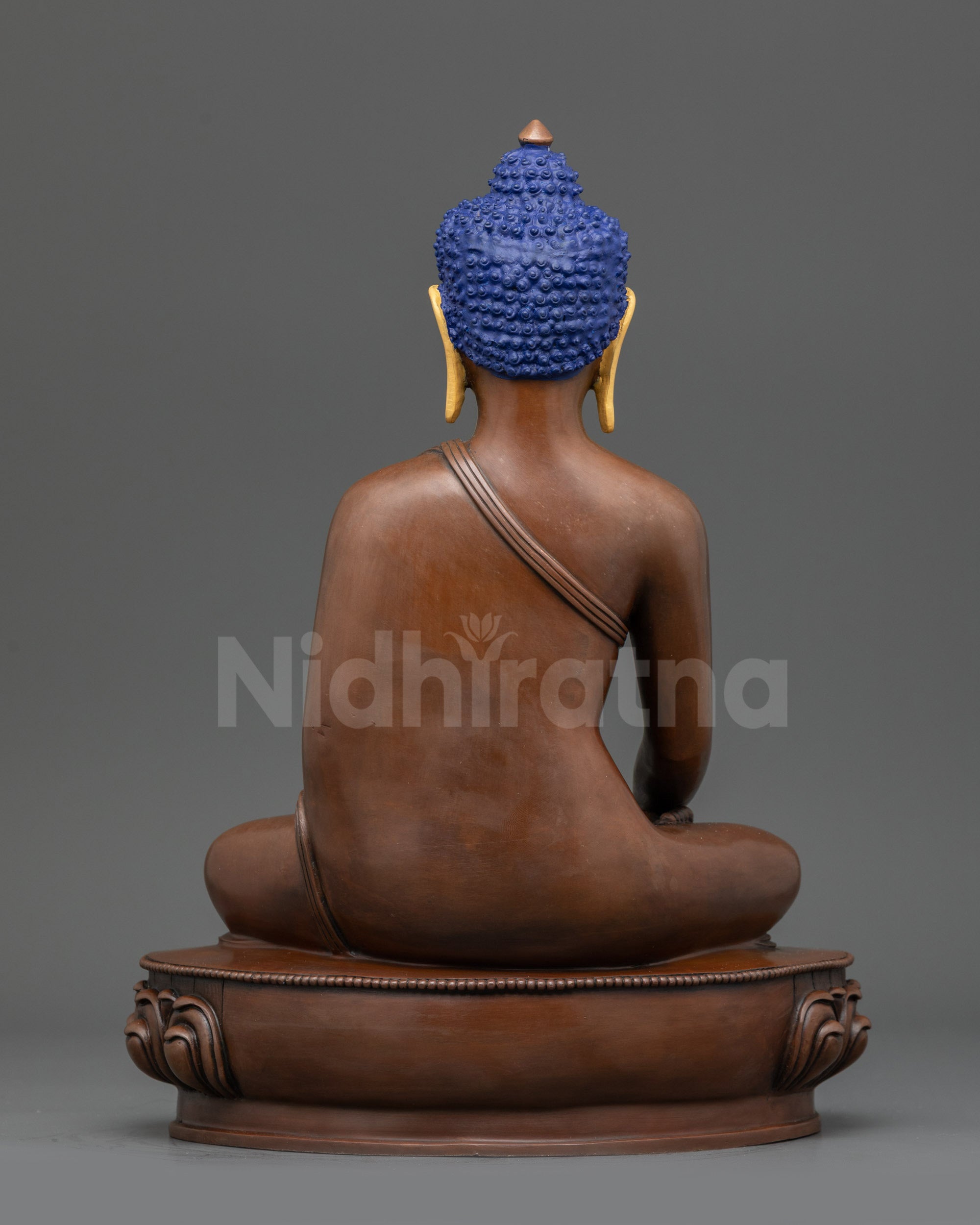 Back view Oxidized Shakyamuni Buddha statue showing carved lotus seat and robe patterns