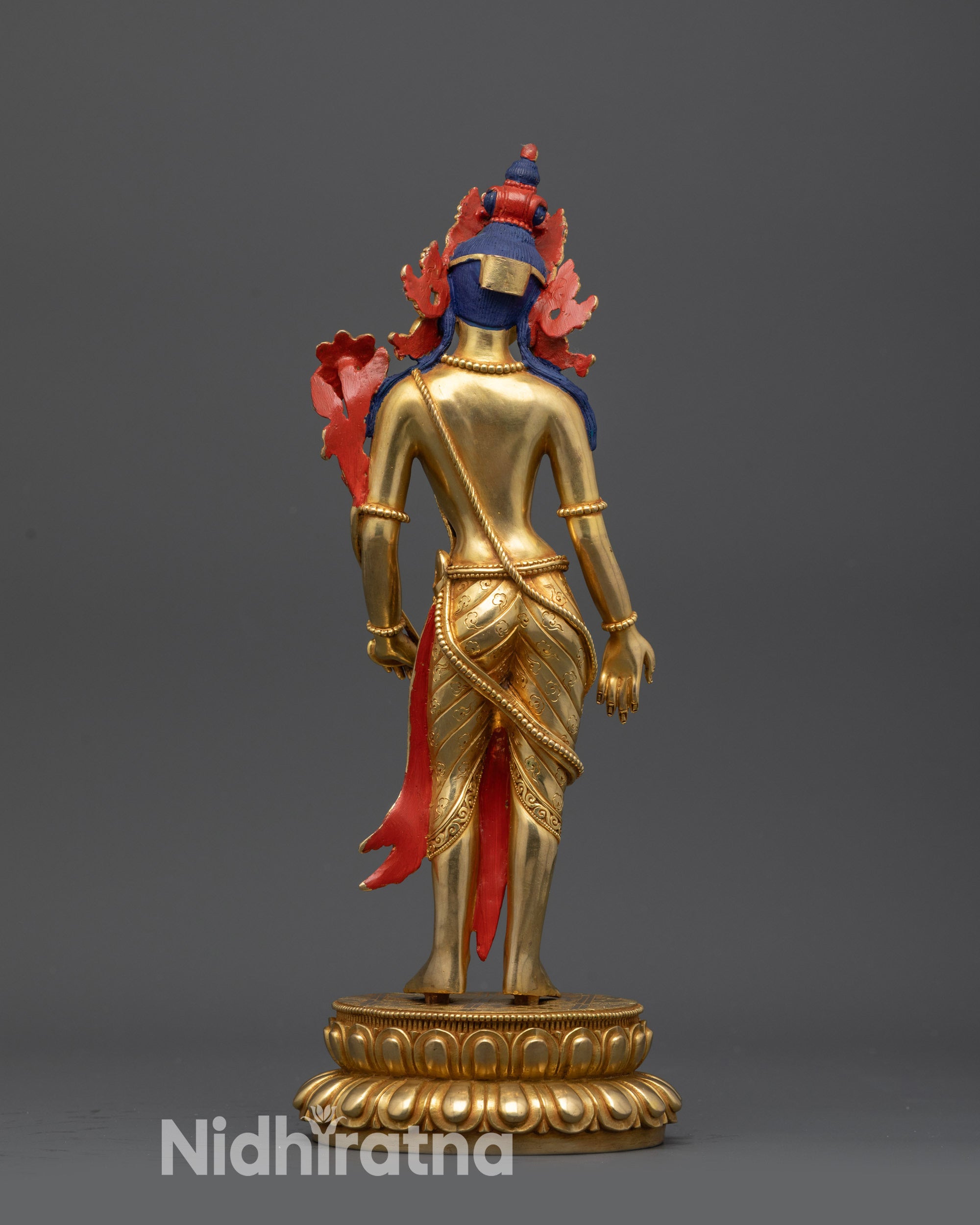 Back view Padmapani statue showing intricate crown and lotus pedestal details