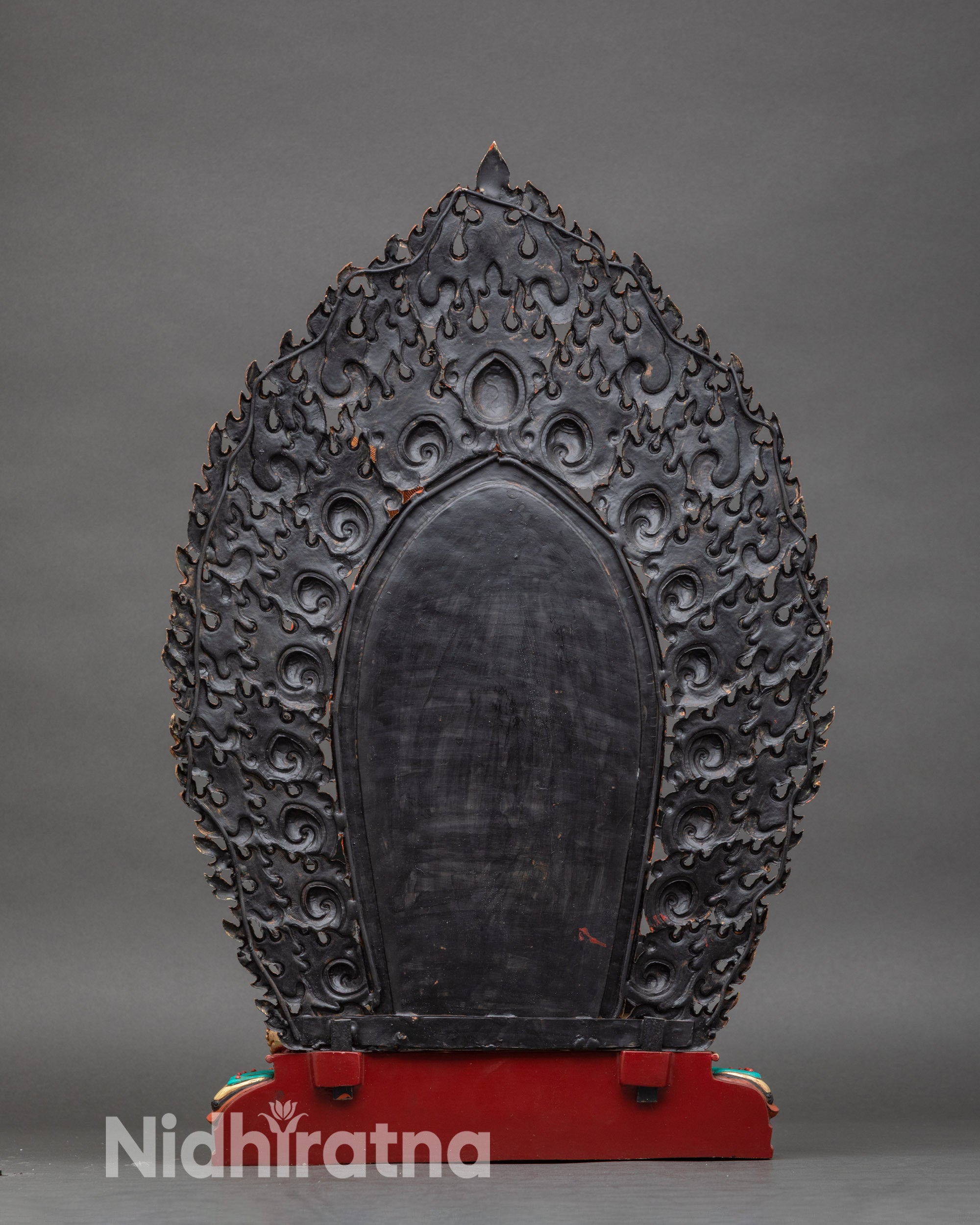 Back view – Rear view of Black Dzambhala statue, swirling flame mandorla and detailed jewelry visible
