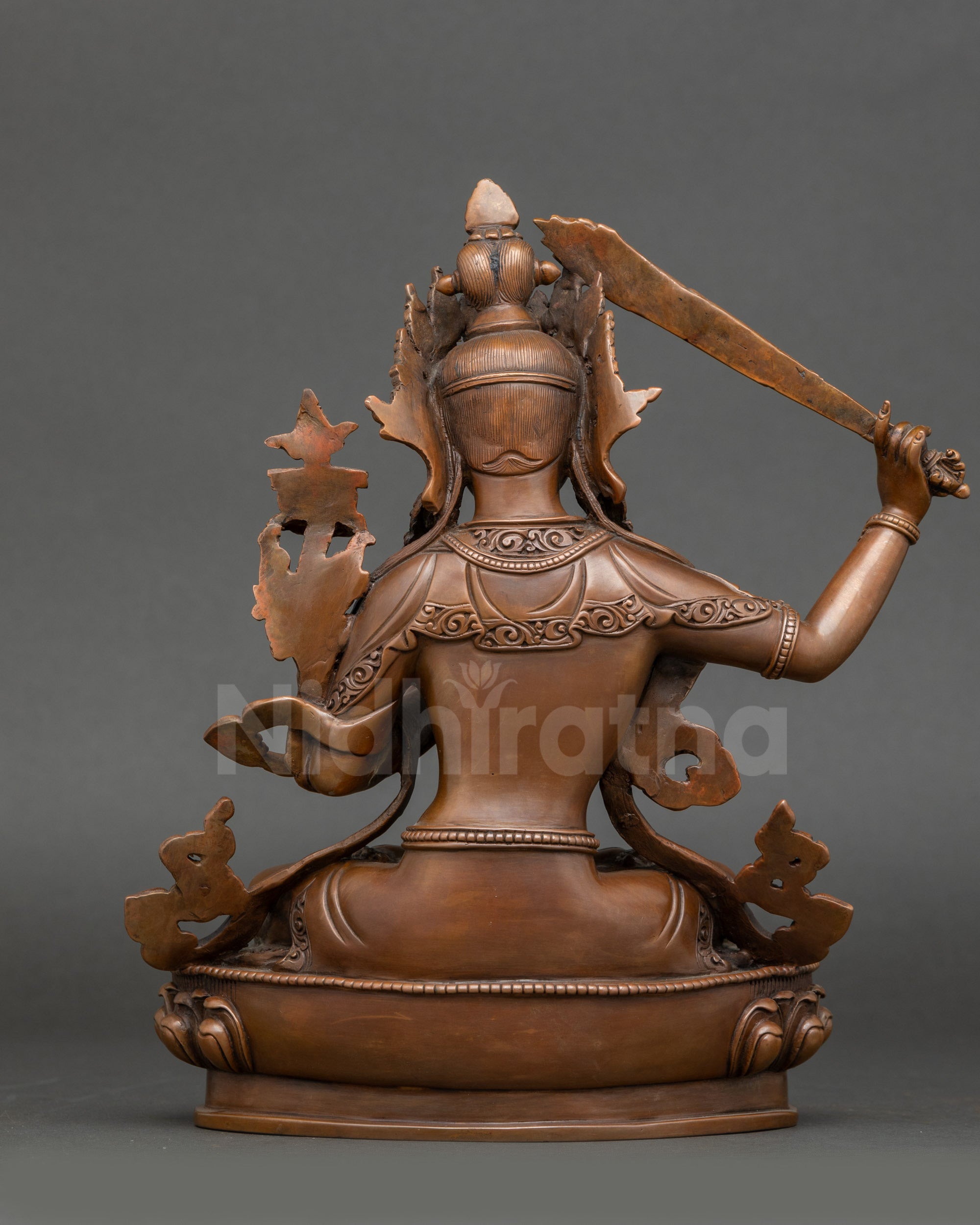 Back view – Rear view of oxidized Manjushri Bodhisattva statue highlighting traditional Nepalese craftsmanship
