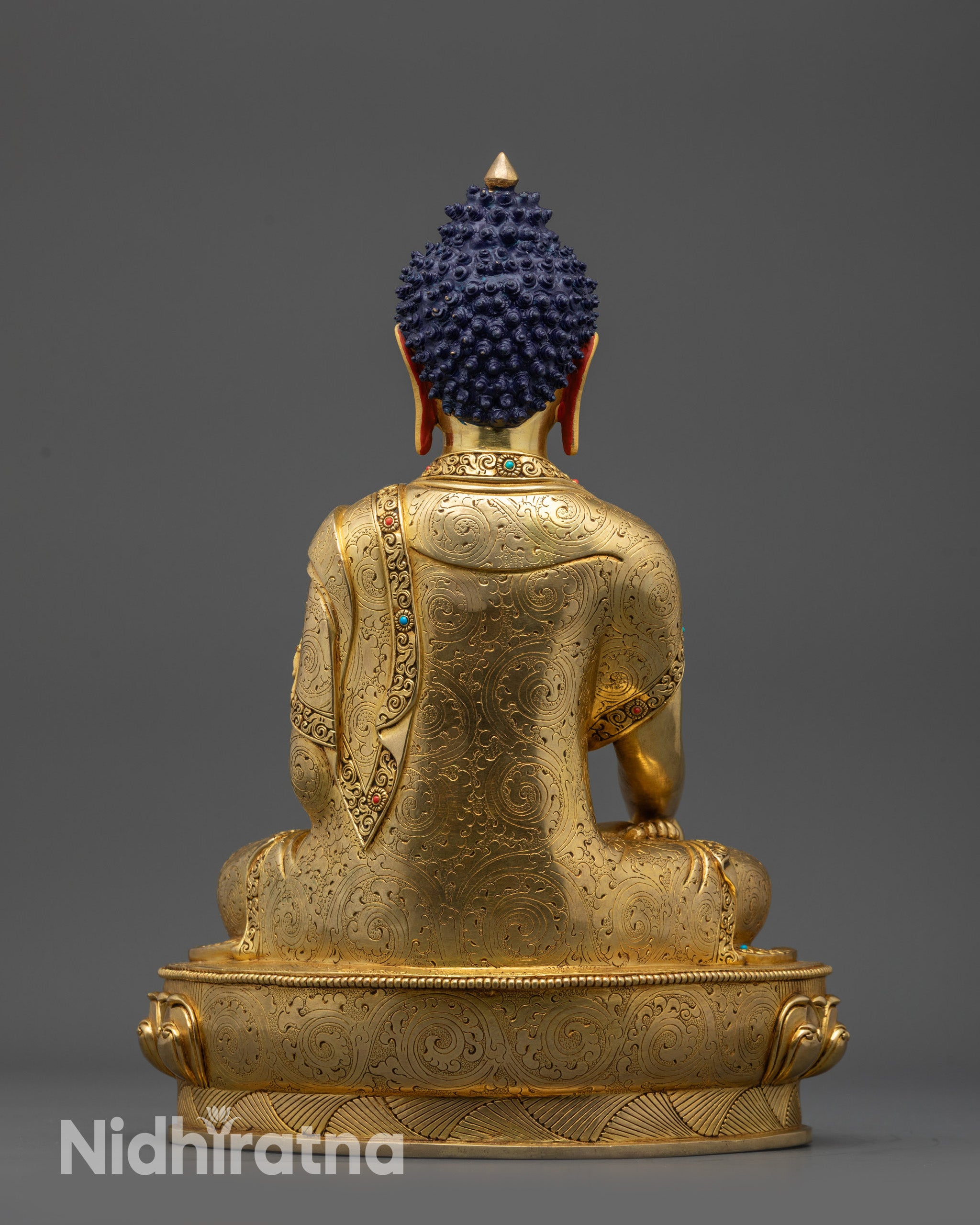 Back view Samana Gotama Statue detailed monk’s robe patterns on lotus pedestal