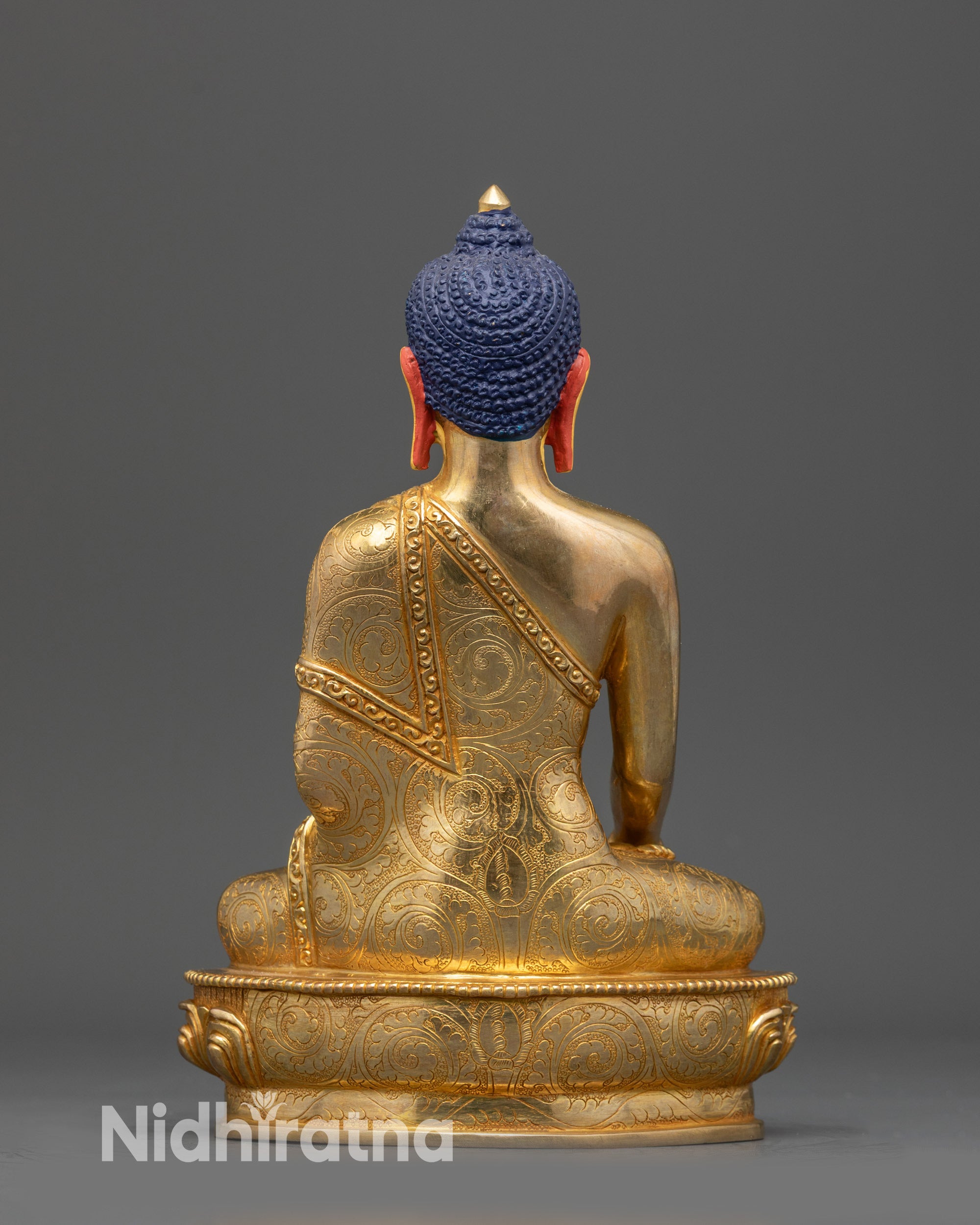 Back view Shakyamuni Buddha statue highlighting carved robe details and gold fire-gilded finish