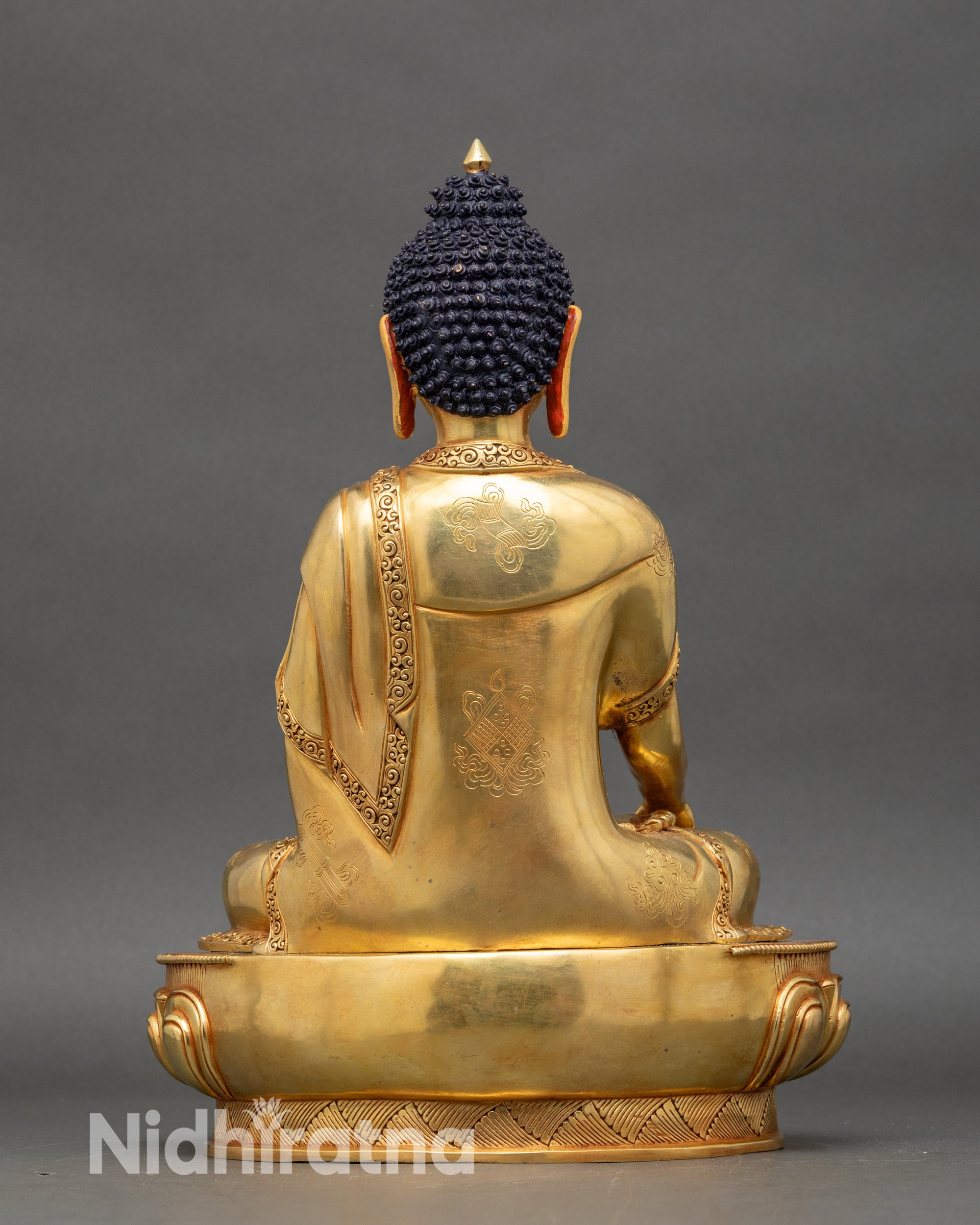Back view Shakyamuni Buddha statue intricate robes auspicious symbols copper sculpture Nepal
