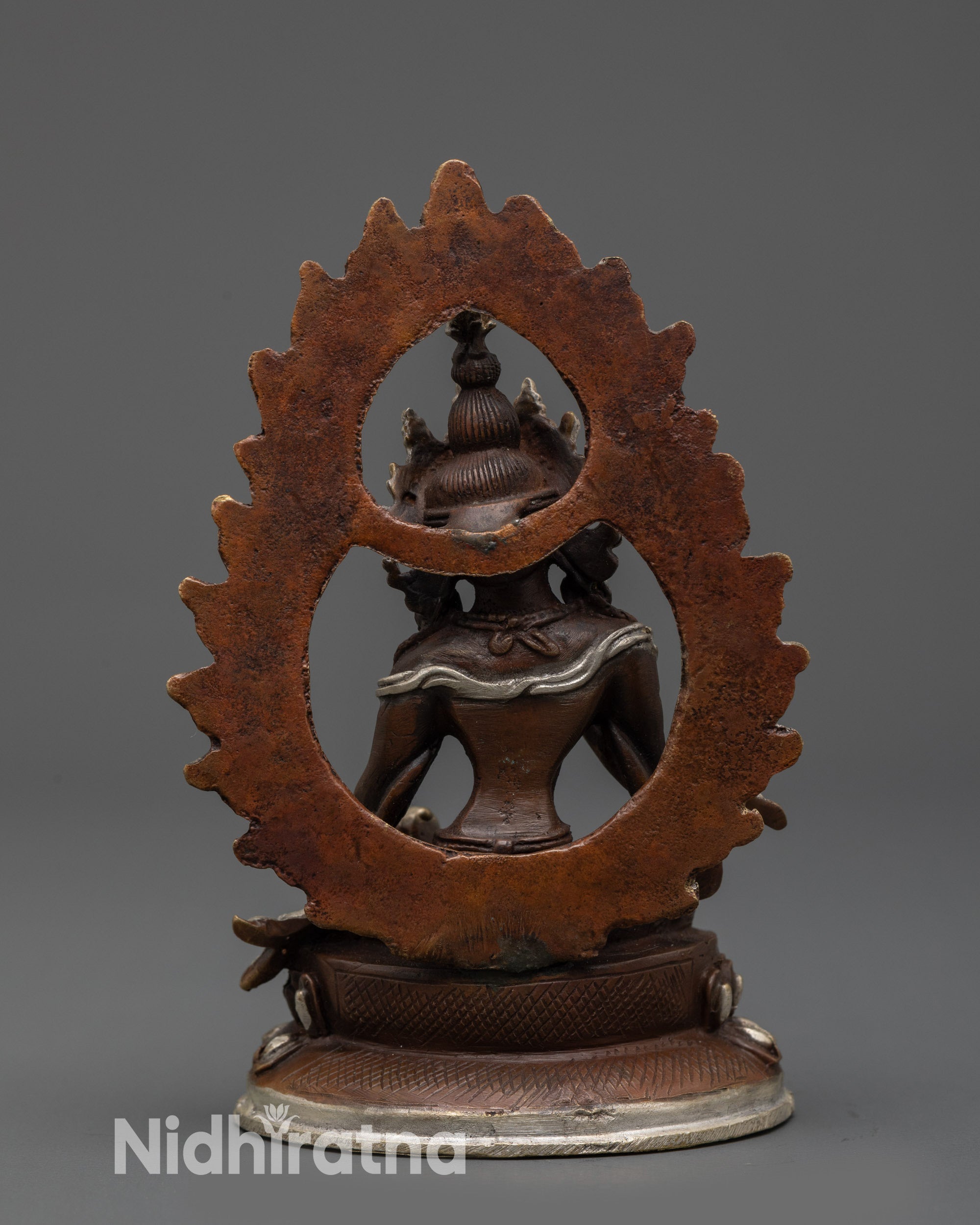 Back view Vajrasattva statue showing halo and detailed robes