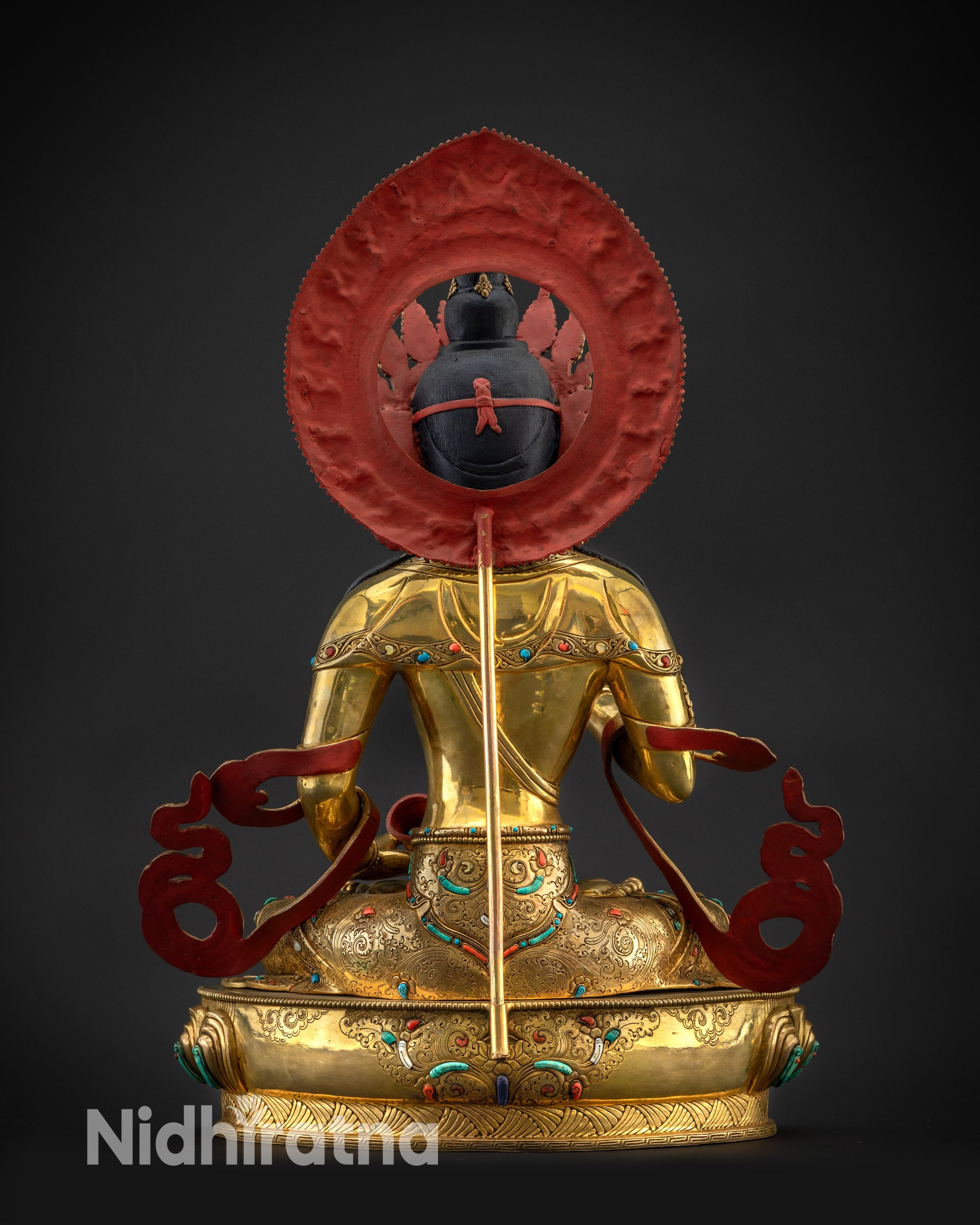 Back view Vajrasattva statue with carved robe patterns and detailed lotus base