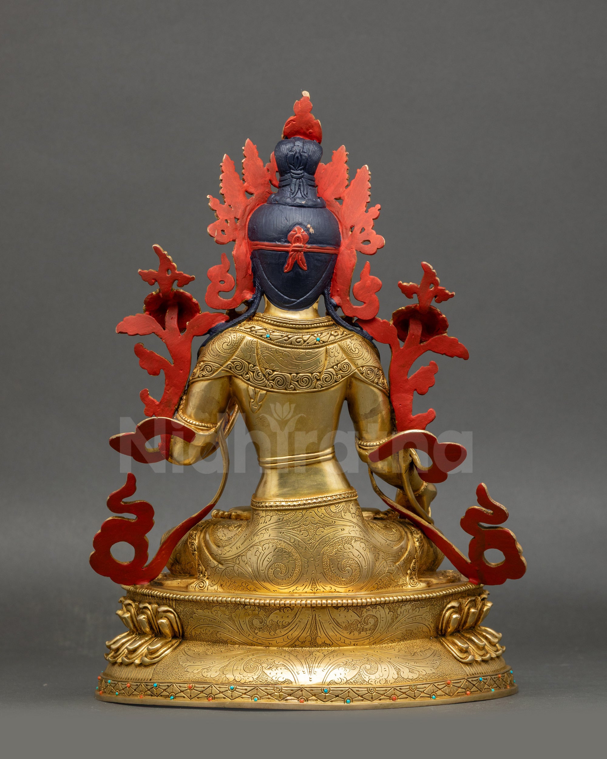 Back view White Tara meditation sculpture showing detailed lotus seat and robe carvings