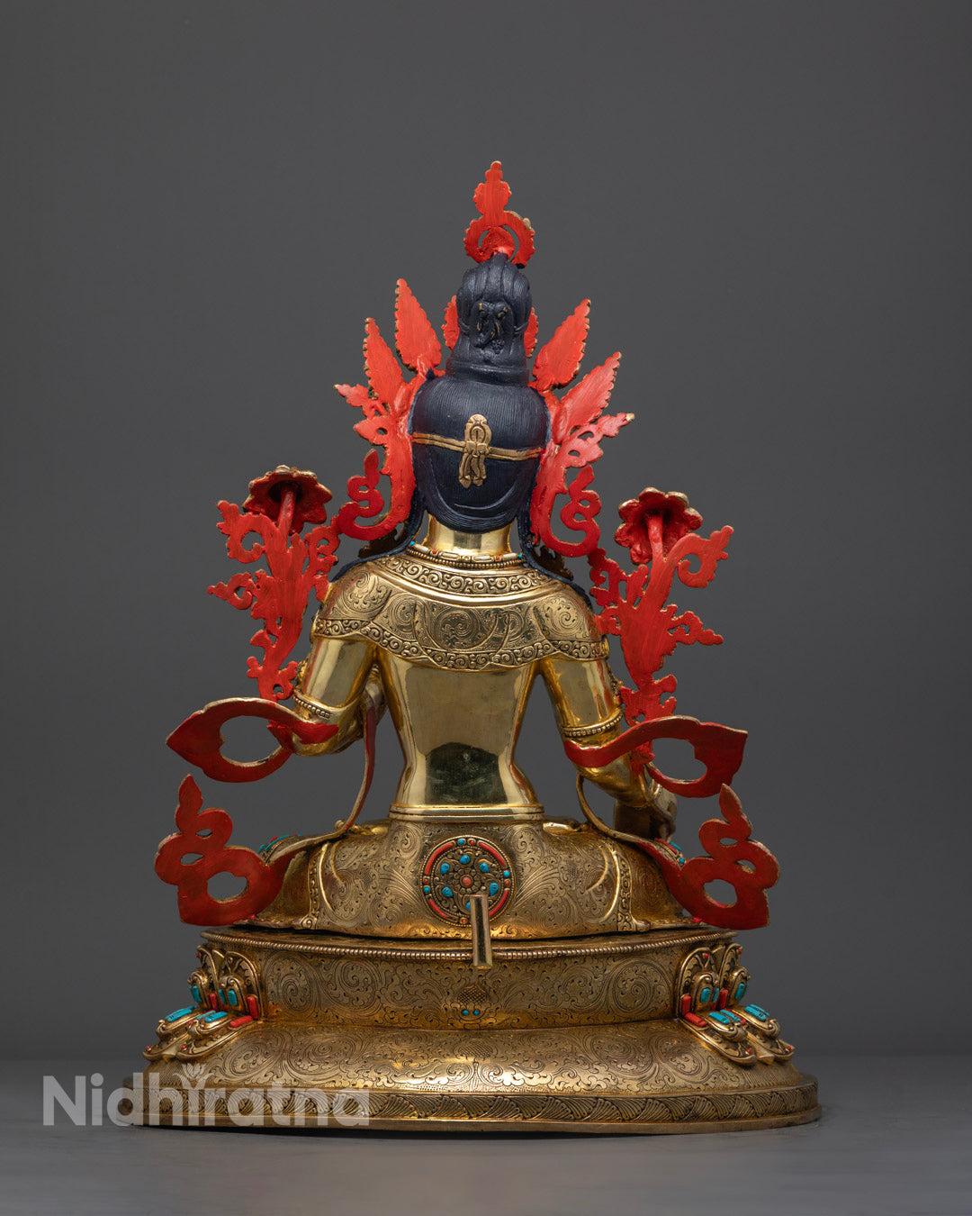 Back view White Tara sculpture with carved robe and ornate lotus throne