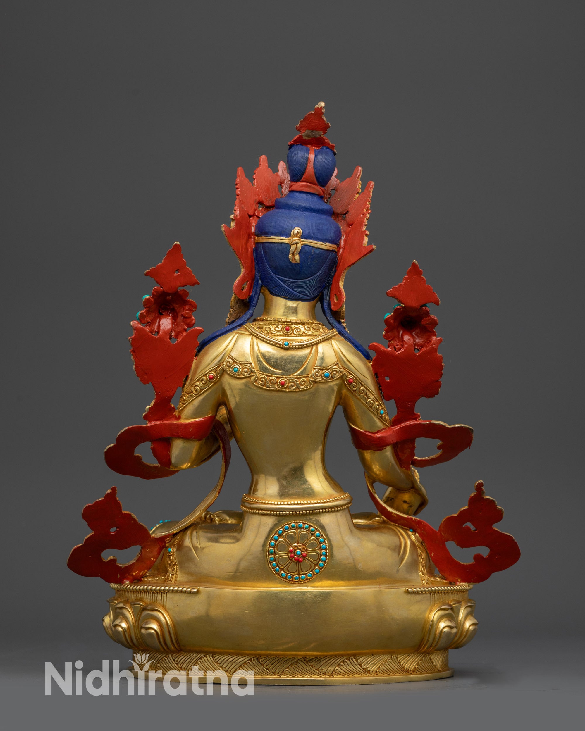 Back view White Tara statue showing carved patterns on lotus seat and detailed jewelry