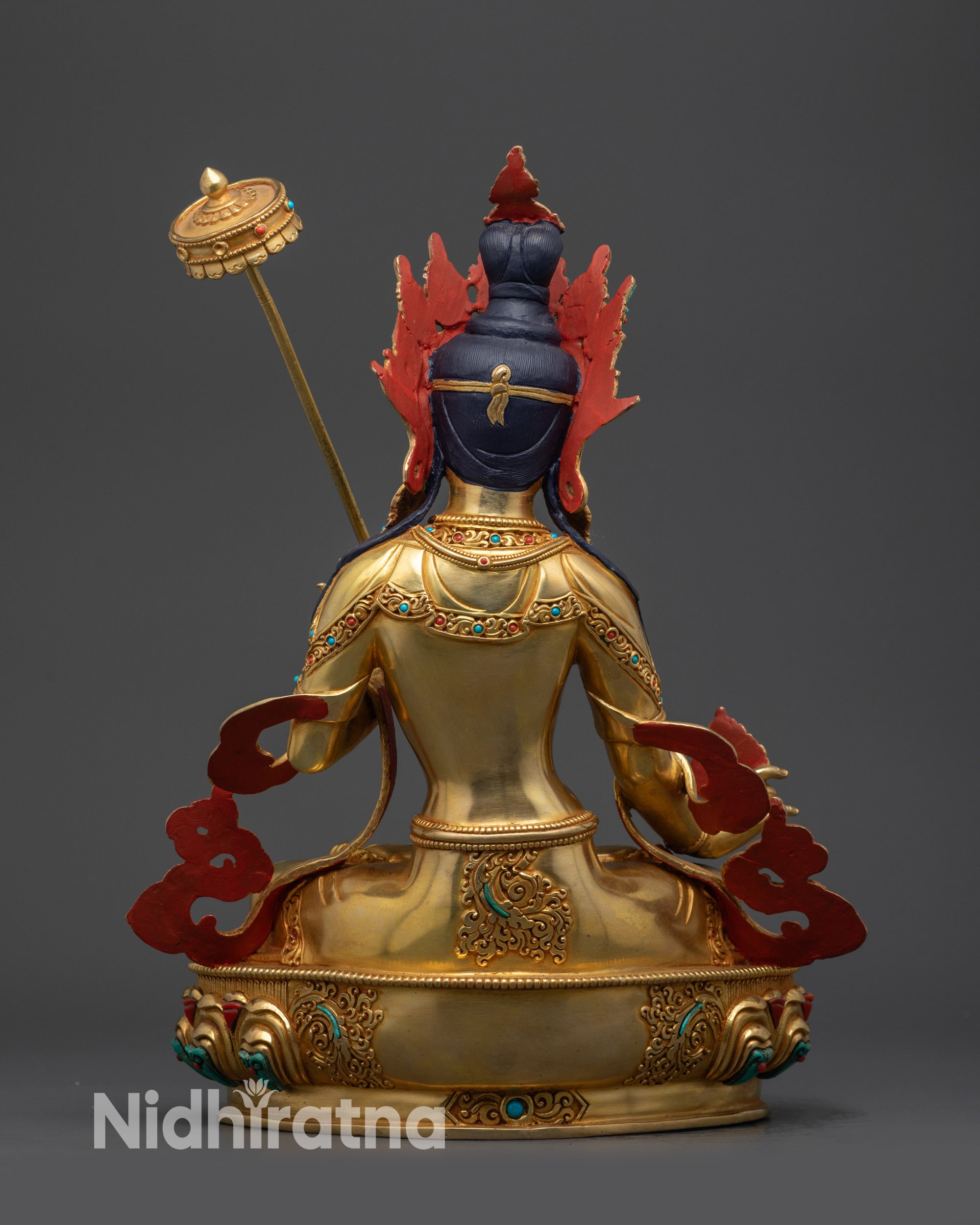 Back view White Umbrella Dukar Statue displaying detailed robe and gold fire-gilded base