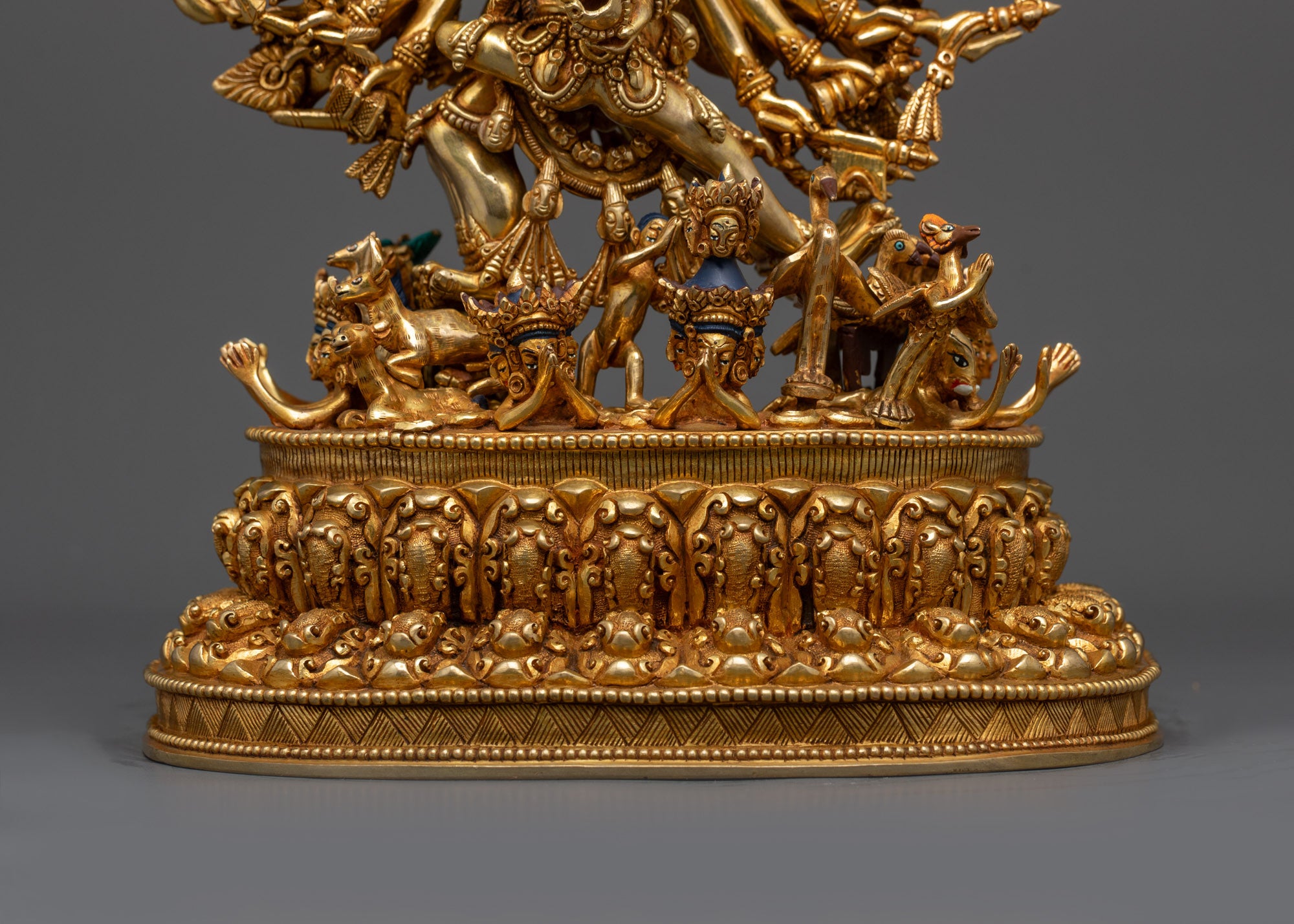 Back view Yamantaka statue showing detailed carving and miniature figure on lotus seat