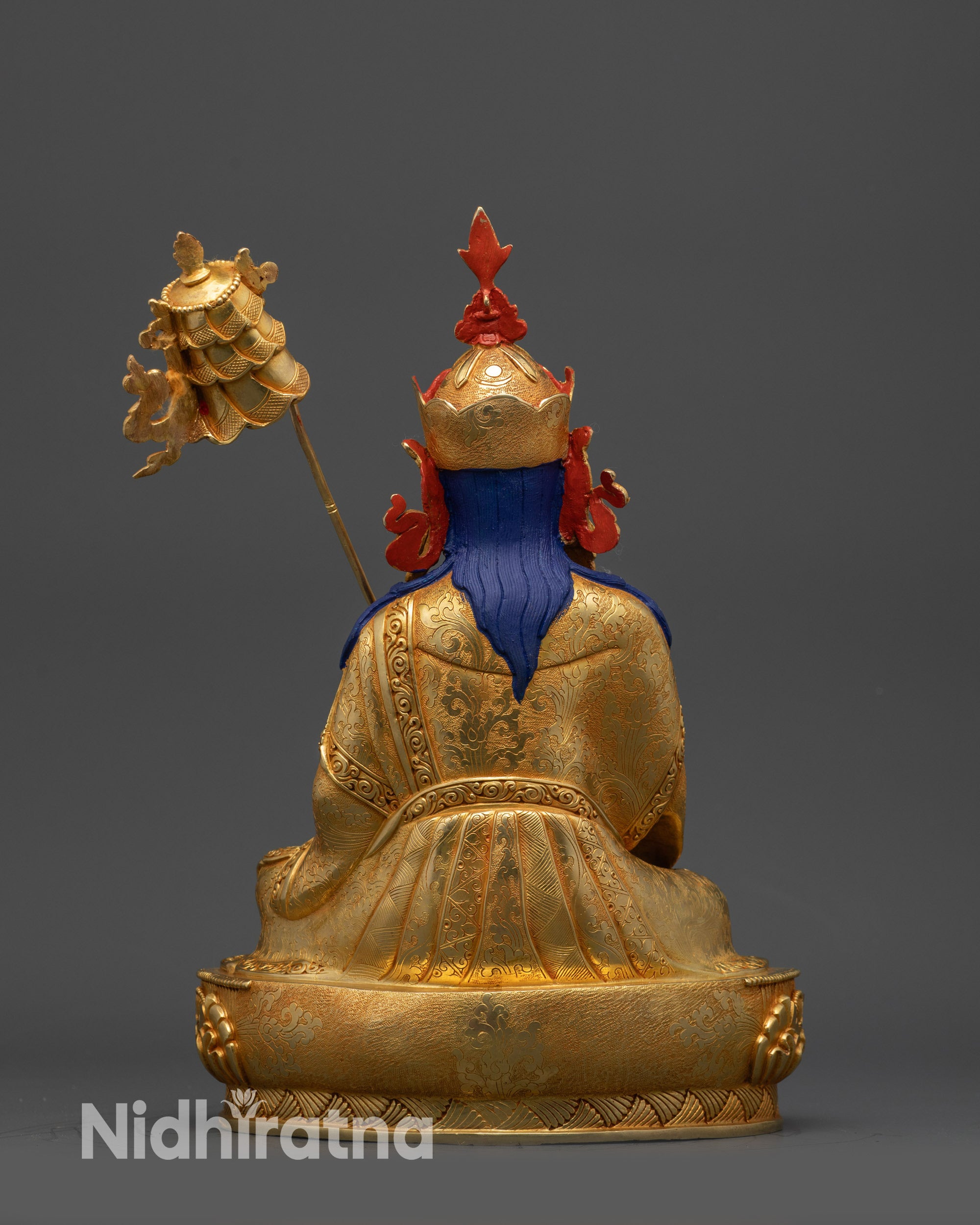 Back view detailed garments and motif patterns of handcrafted Nepalese statue