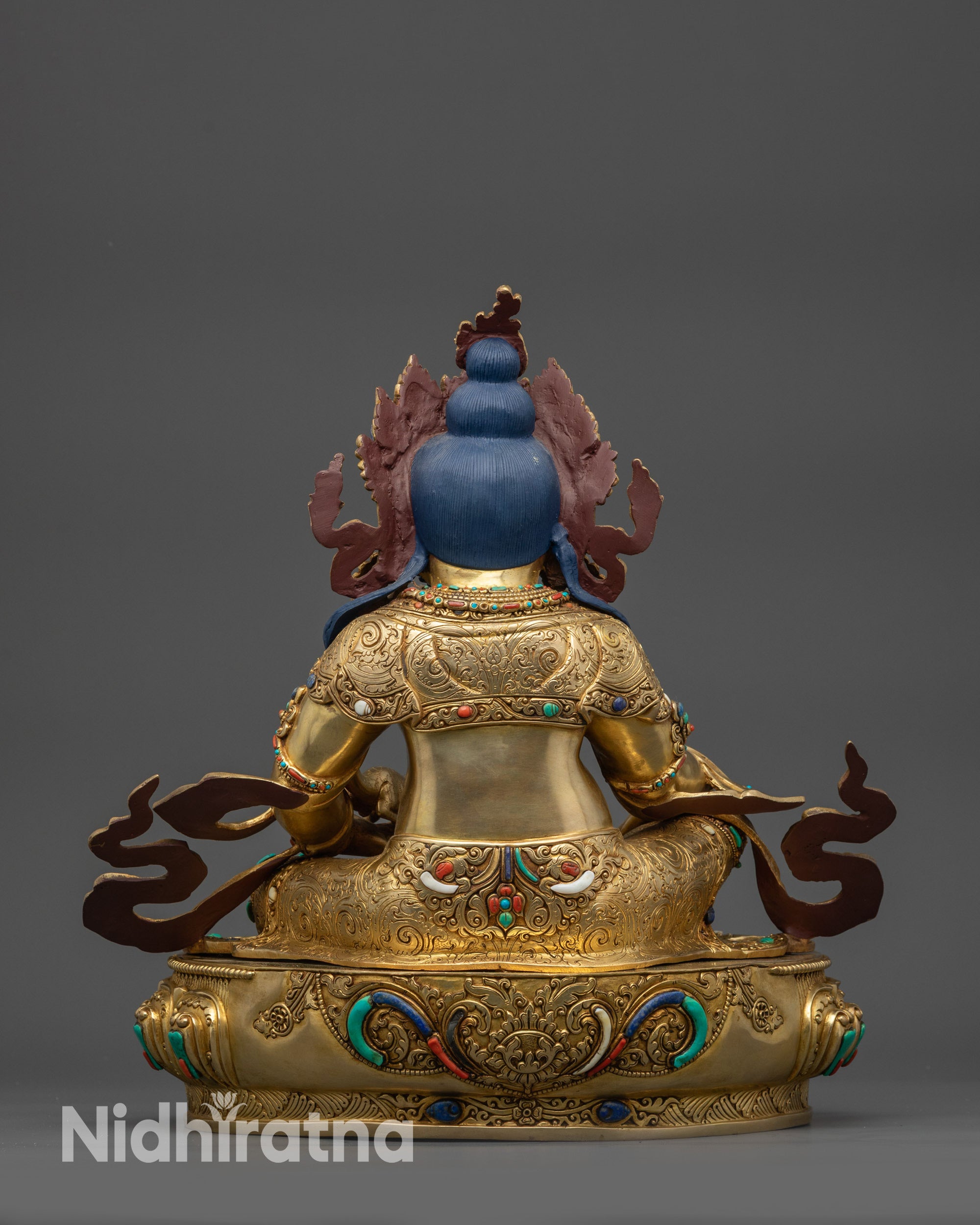 Back view handcrafted Dzambhala statue with detailed carvings and polished finish