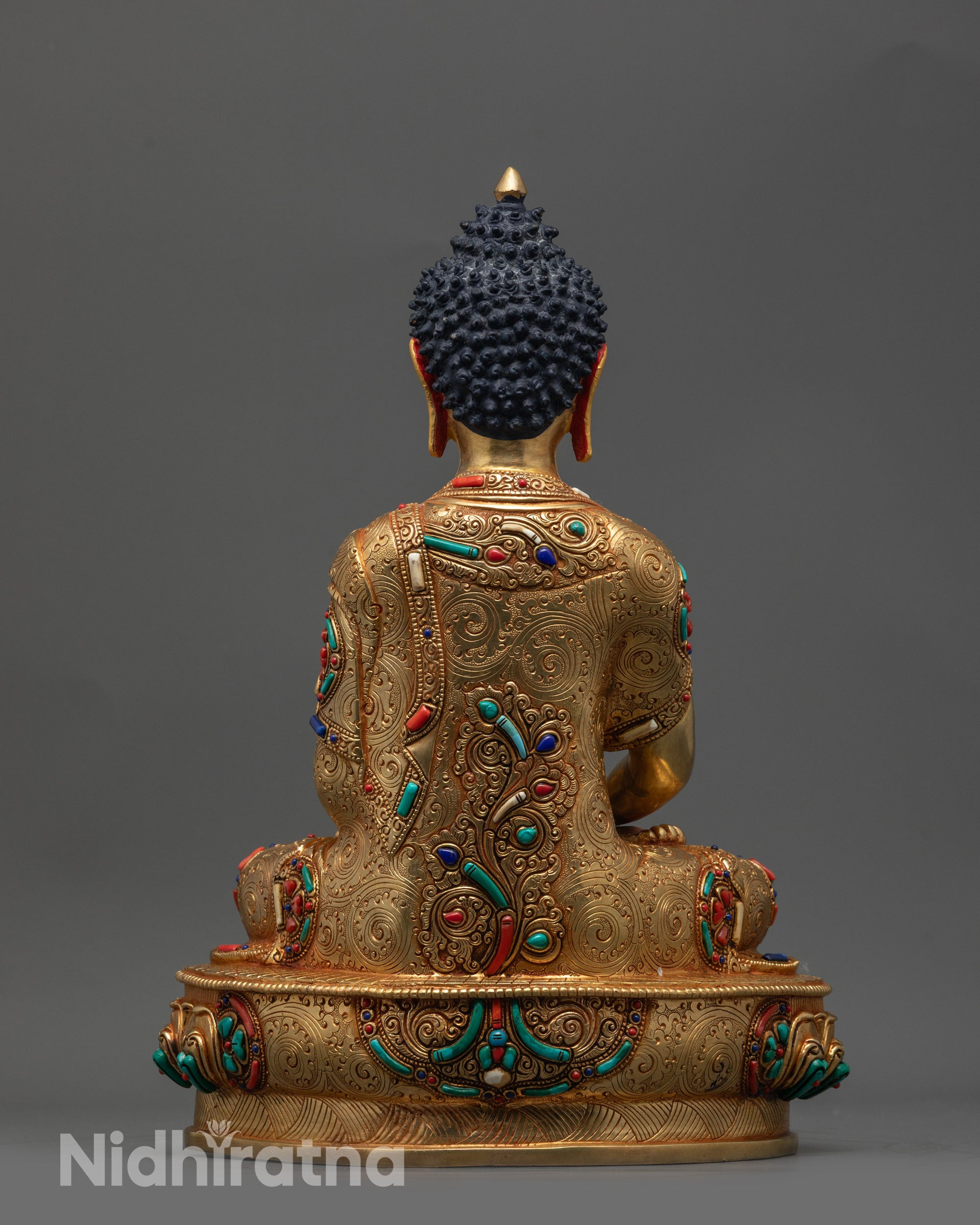 Back view of Amida Nyorai Buddha highlighting carved robe details and artisan craftsmanship