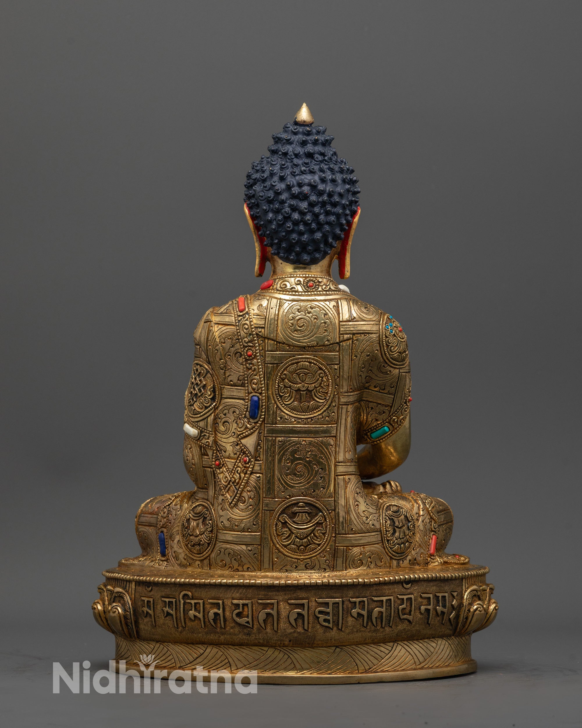 Back view of Amitabha Buddha Statue showing engraved lotus seat and intricate patterns