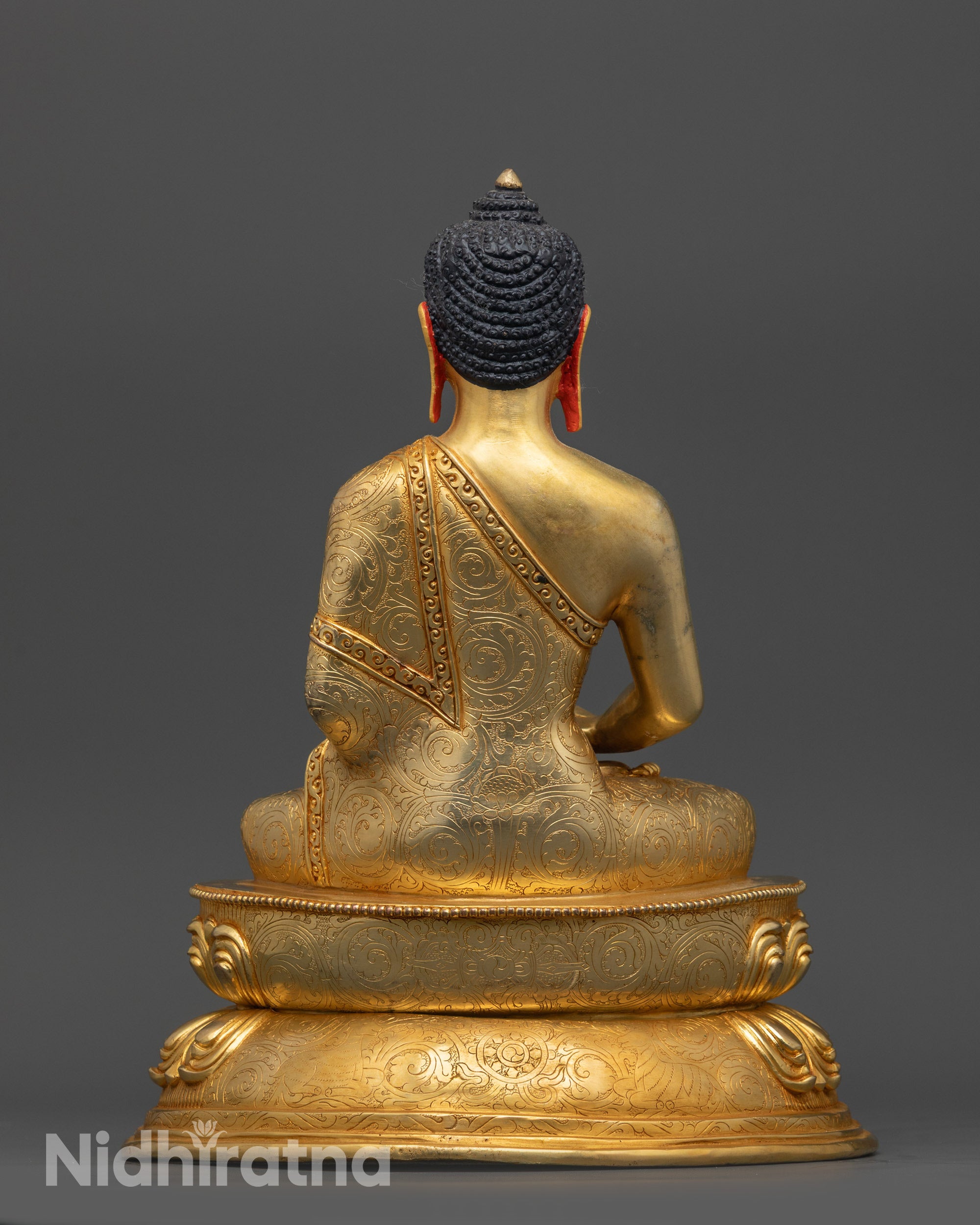 Back view of Amitabha Buddha Statue with intricate monk robe patterns on copper base