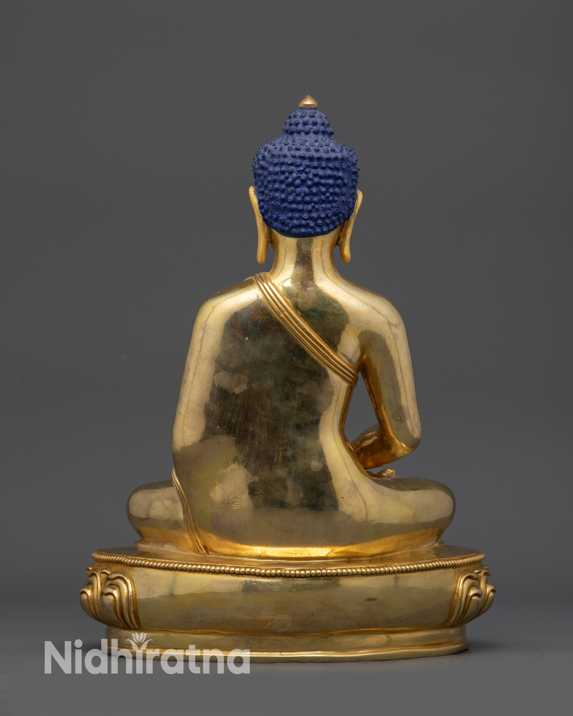Back view of Amitabha Buddha meditation sculpture with polished copper base and detailed robes