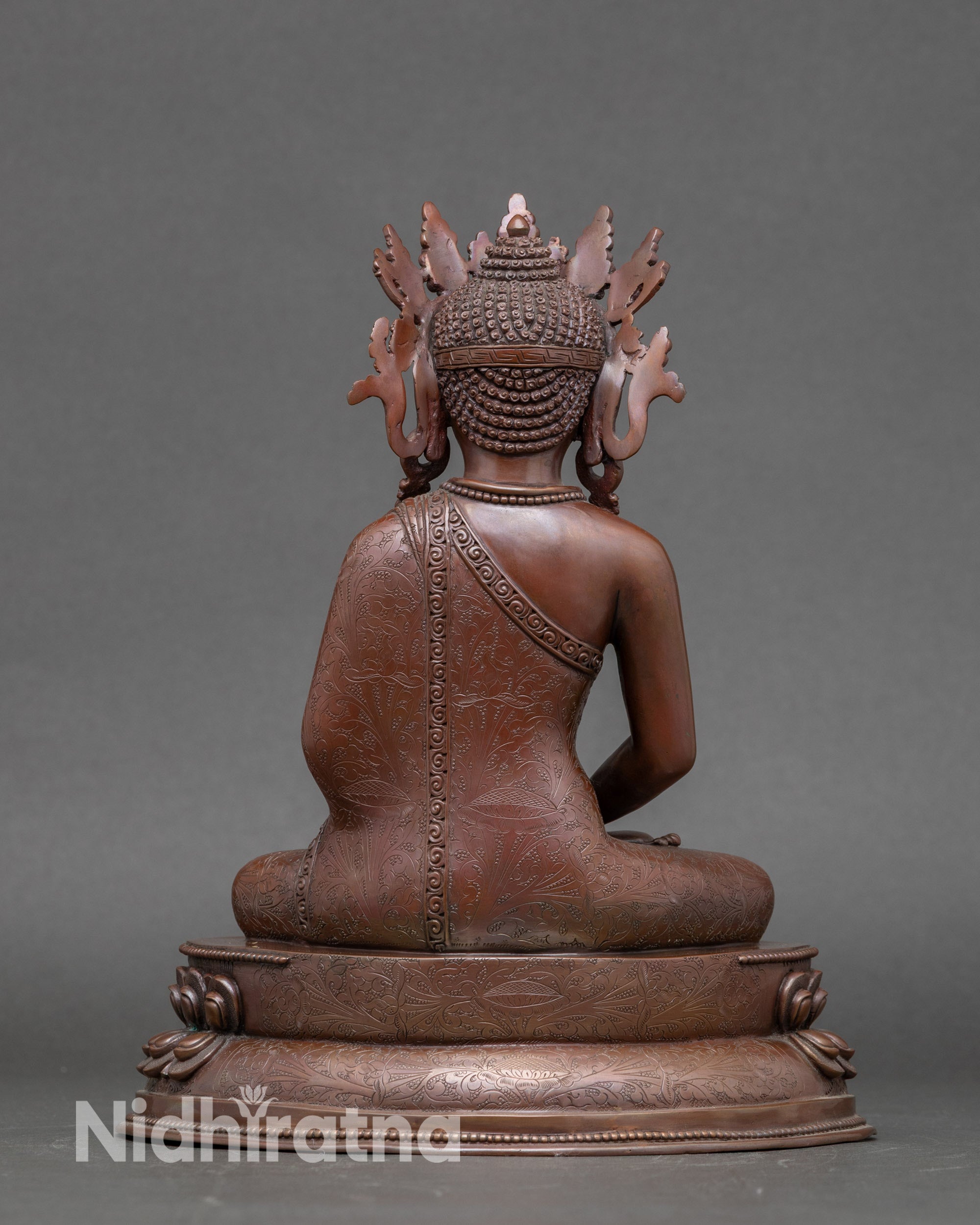 Back view of Amitabha Buddha statue showing detailed lotus pedestal and crown