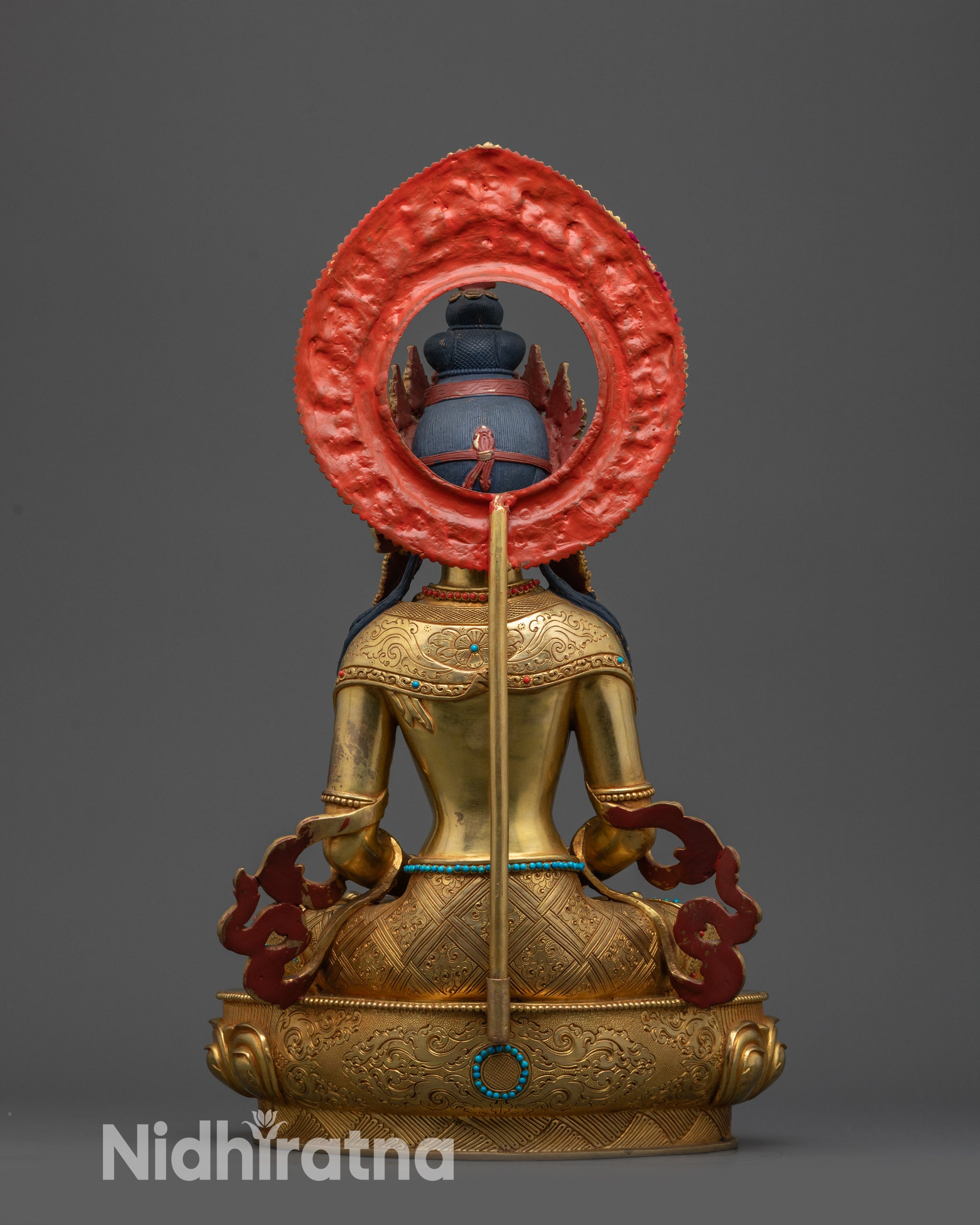 Back view of Amitayus Statue showing flowing robes and lotus pedestal